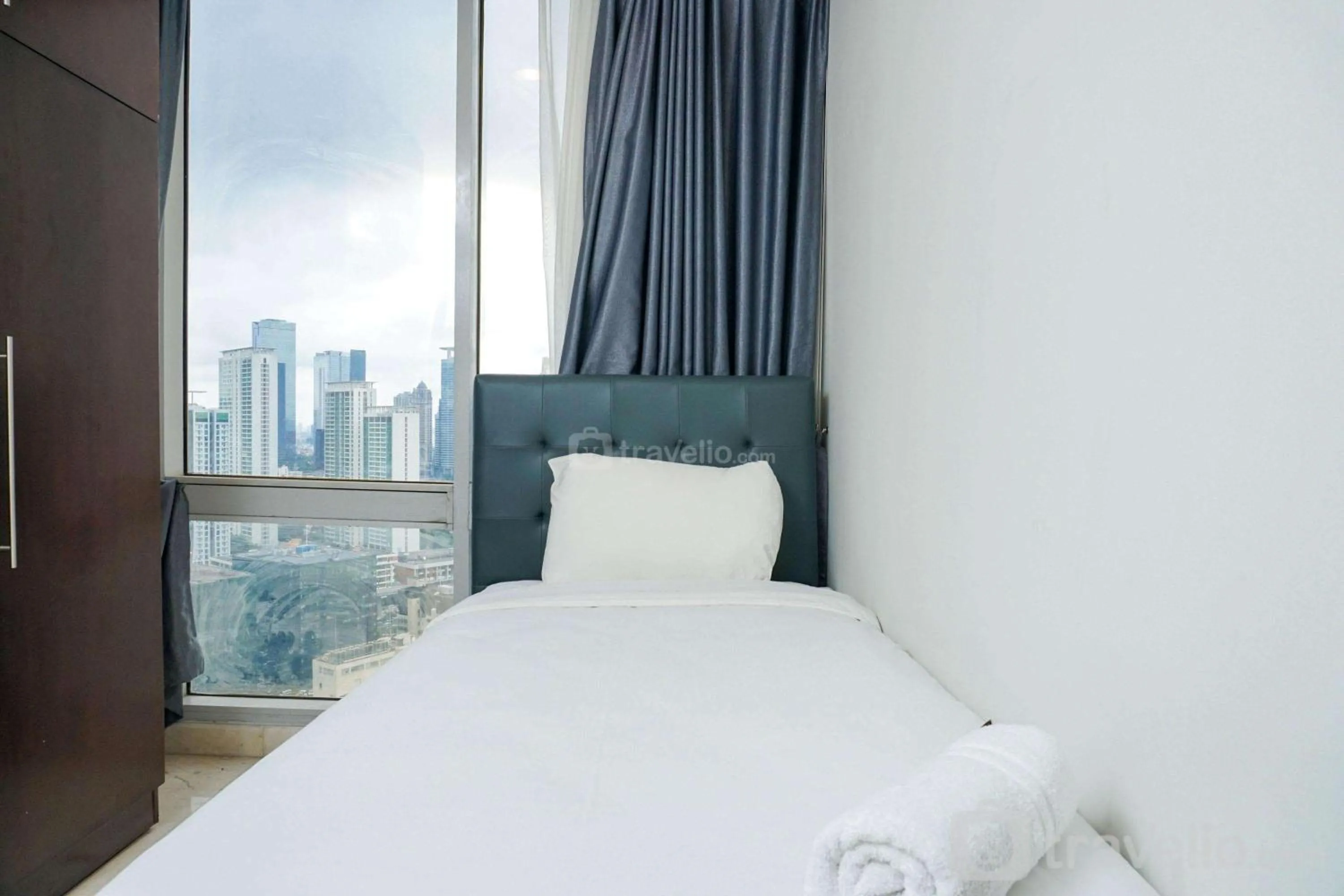 Cozy 2BR at Empyreal Epicentrum Apartment By Travelio