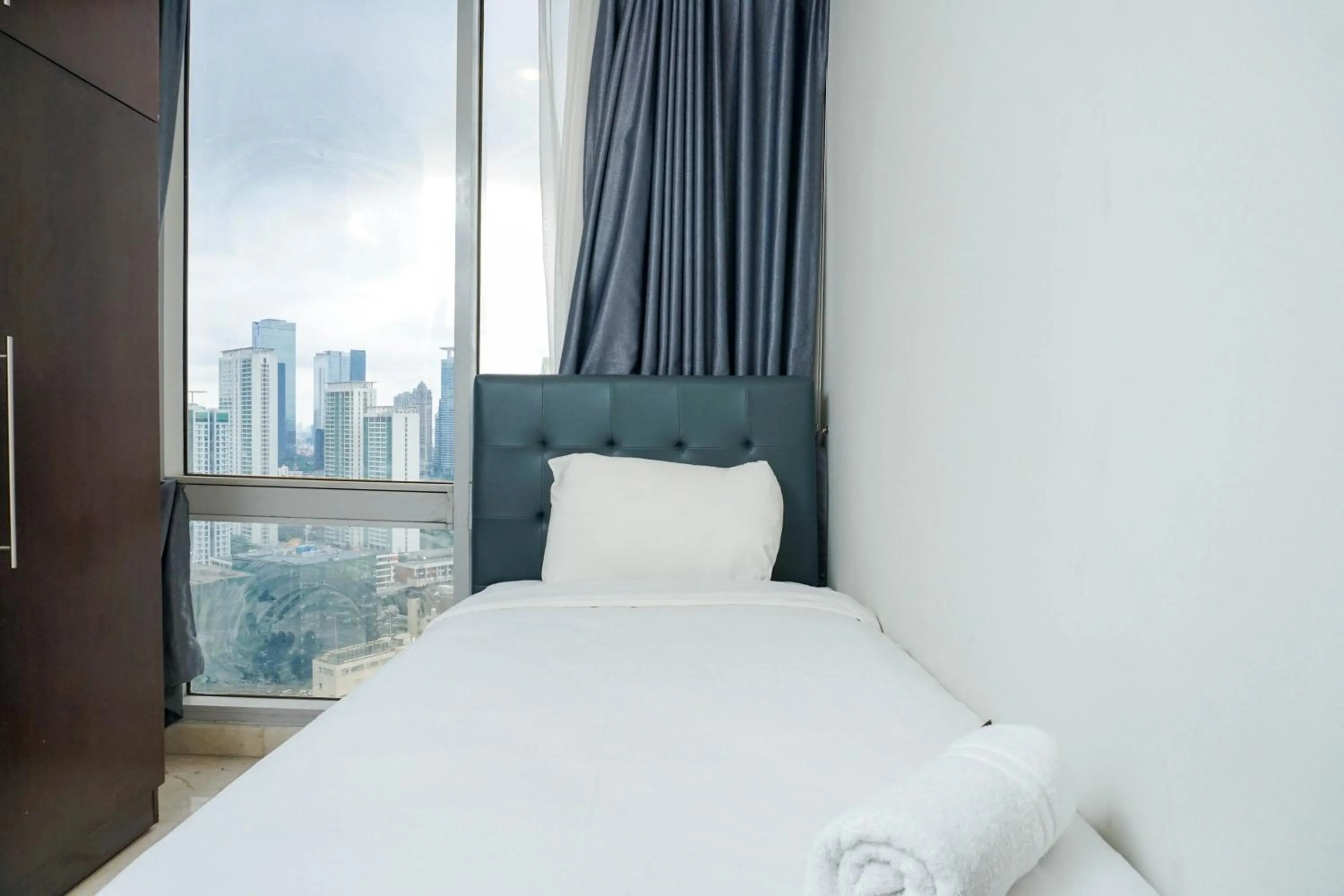 Cozy 2BR at Empyreal Epicentrum Apartment By Travelio