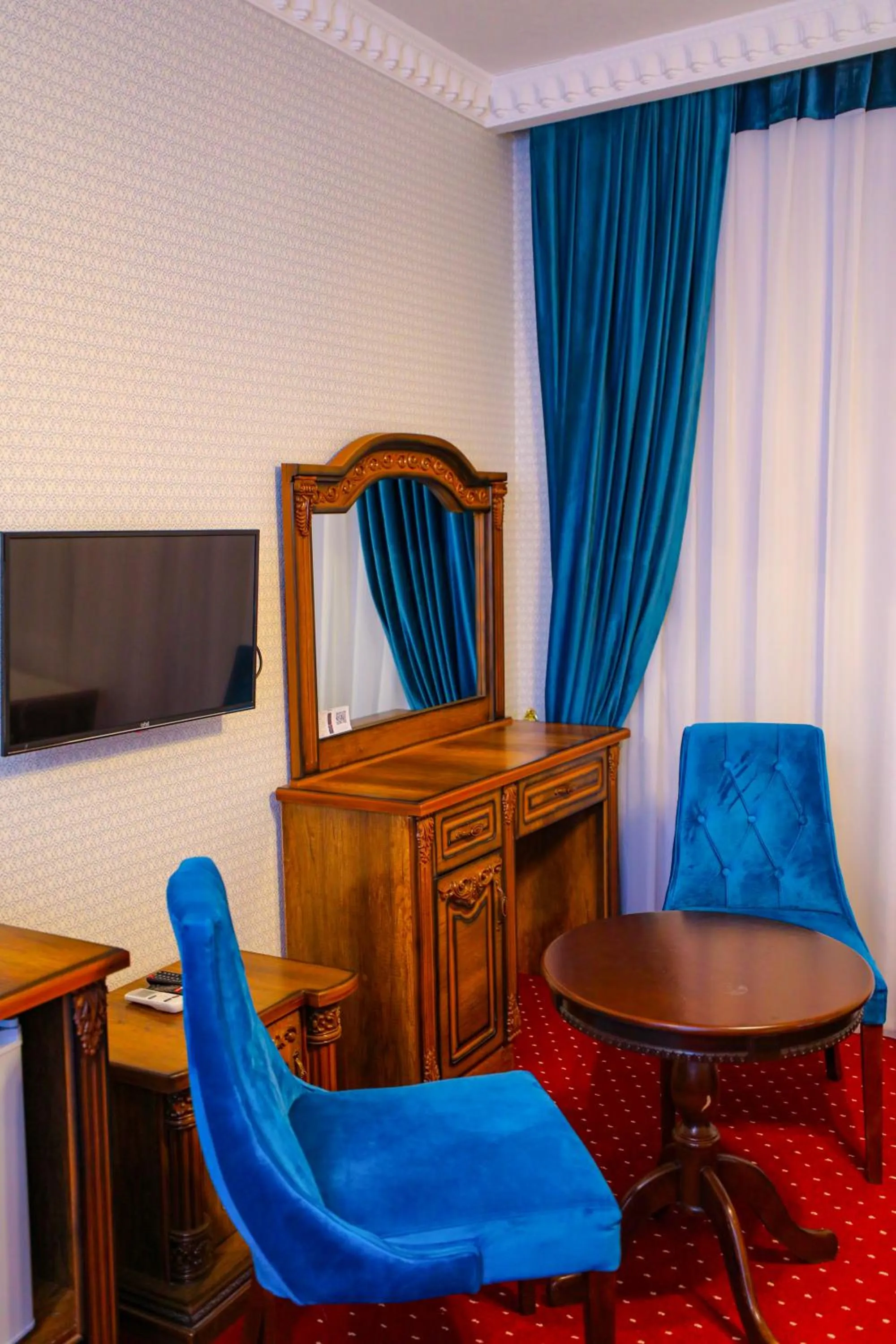 Seating area in Dendi Plaza Hotel