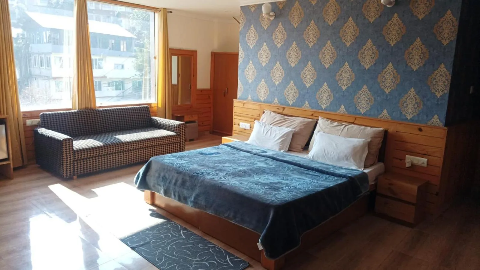 Bed in McLeod Ganj Mountain view