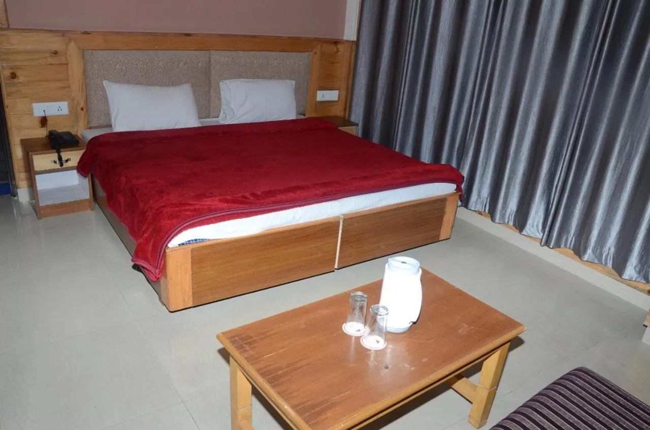 Bed in McLeod Ganj Mountain view