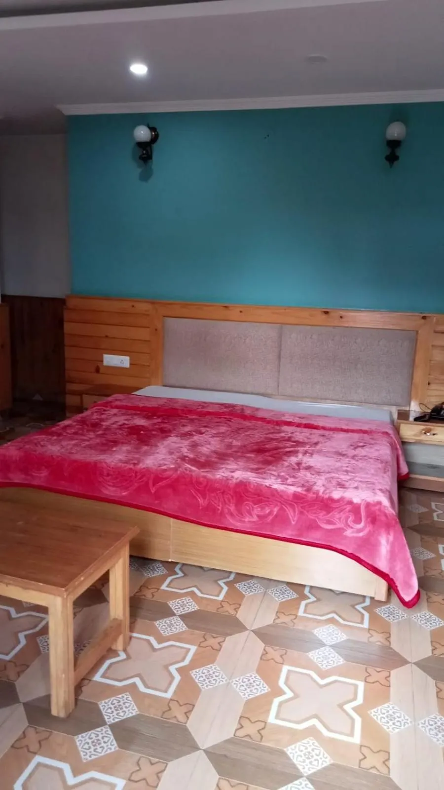 Bed in McLeod Ganj Mountain view