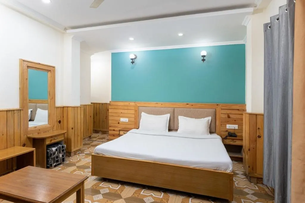 Bed in McLeod Ganj Mountain view