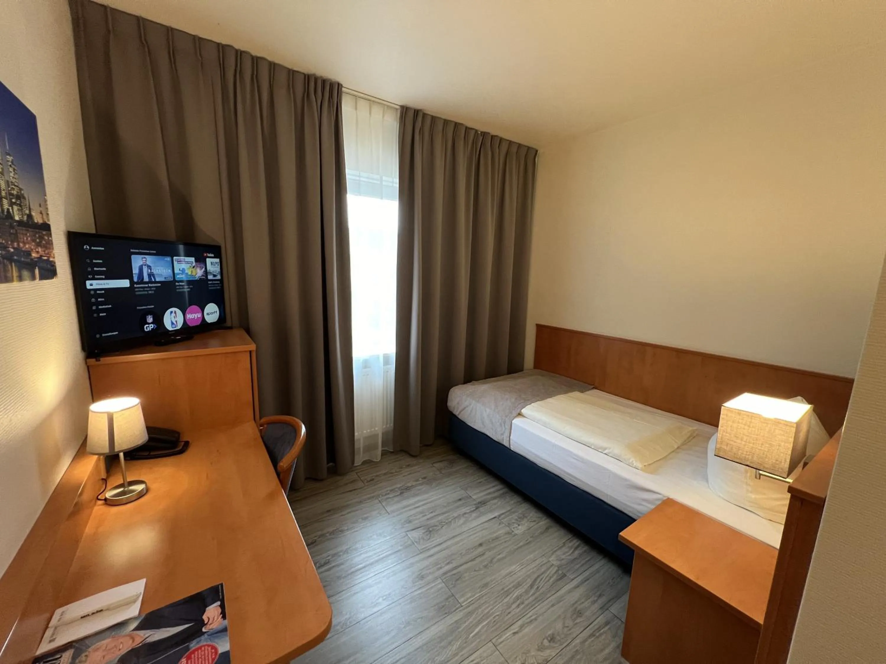 Photo of the whole room, Bed in Hotel Niederräder Hof