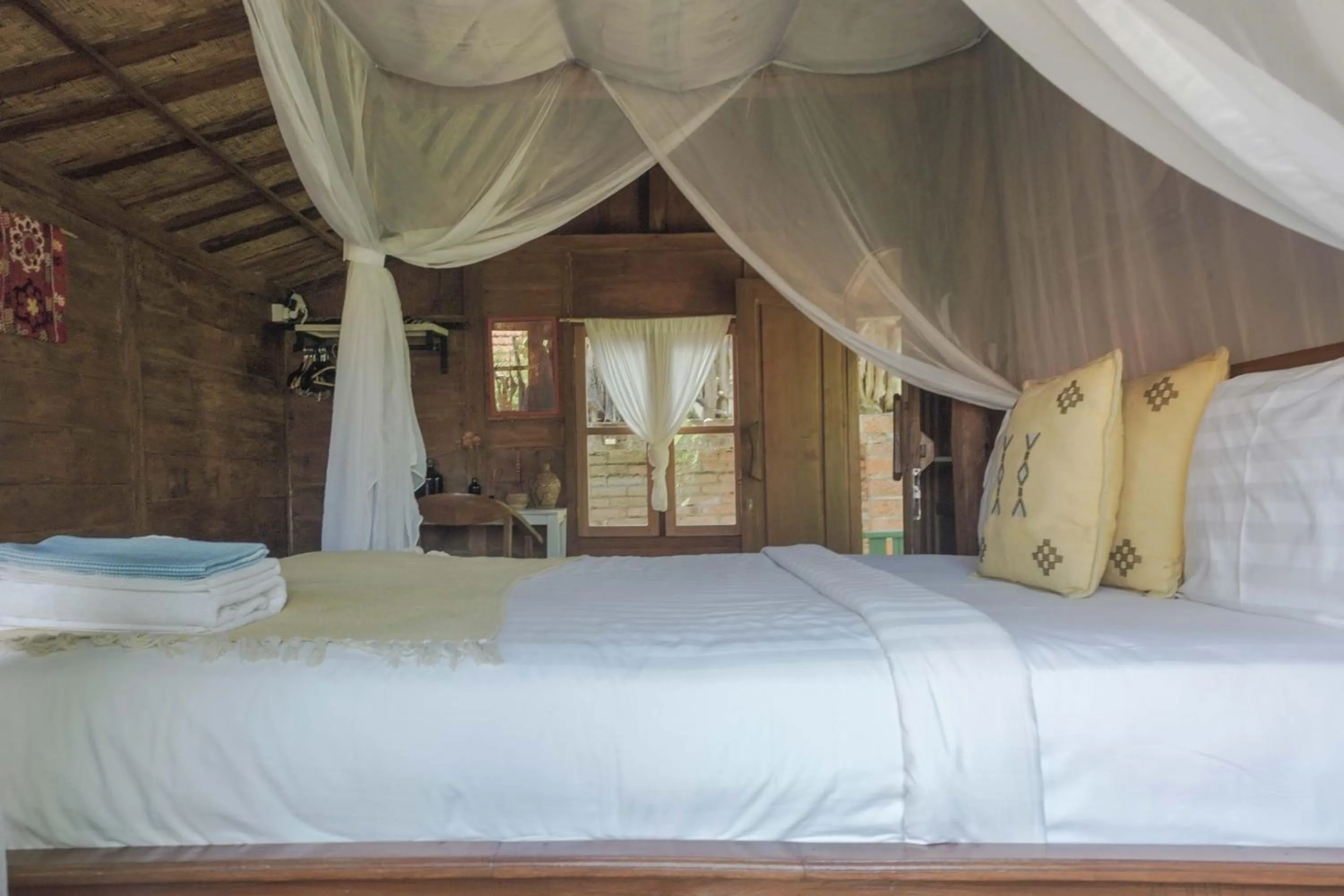 Bed in Ubuntu Bali Eco Yoga Retreat - CANGGU