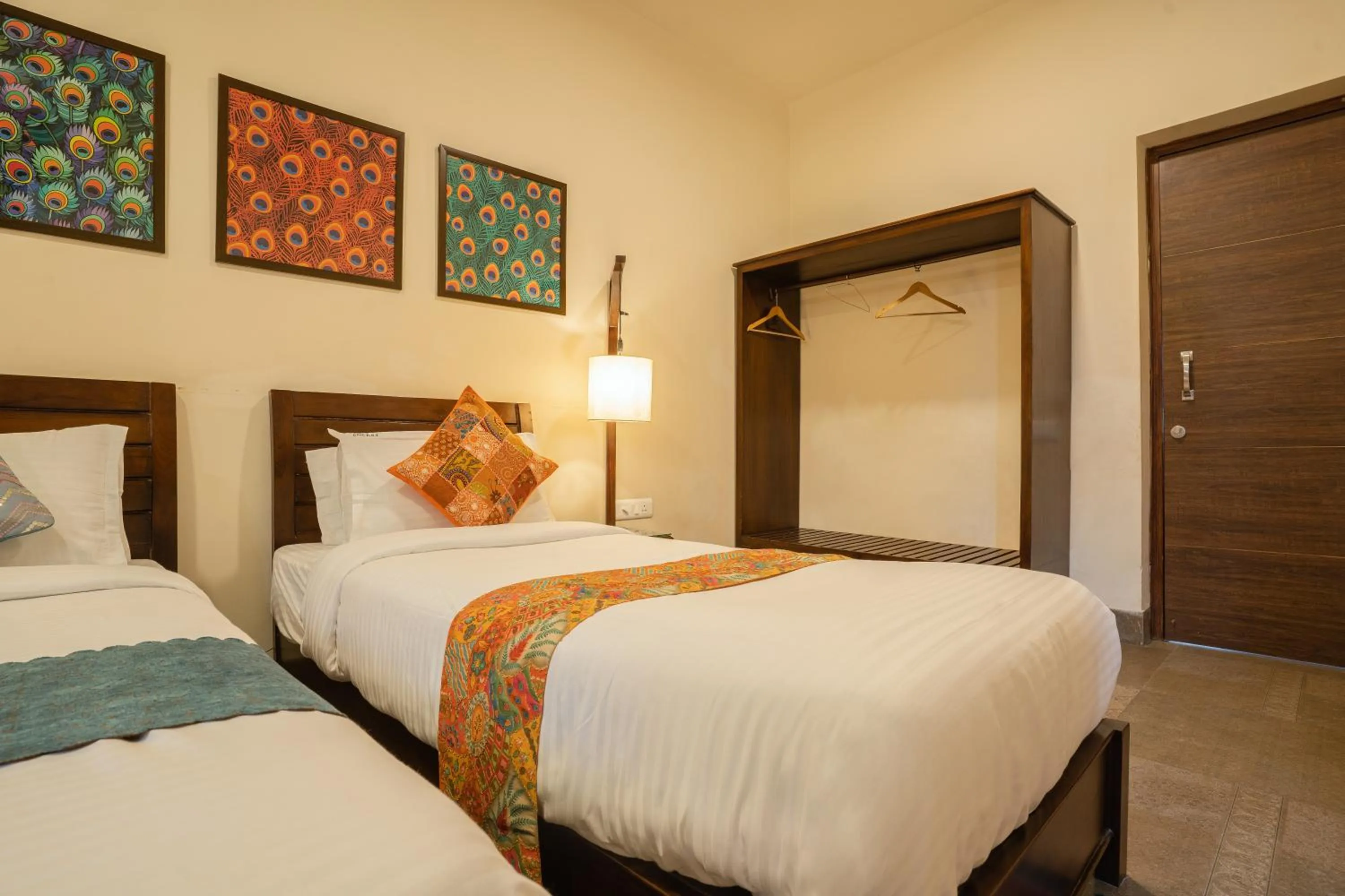 Bed in Tripli Hotels Shambhu Villas