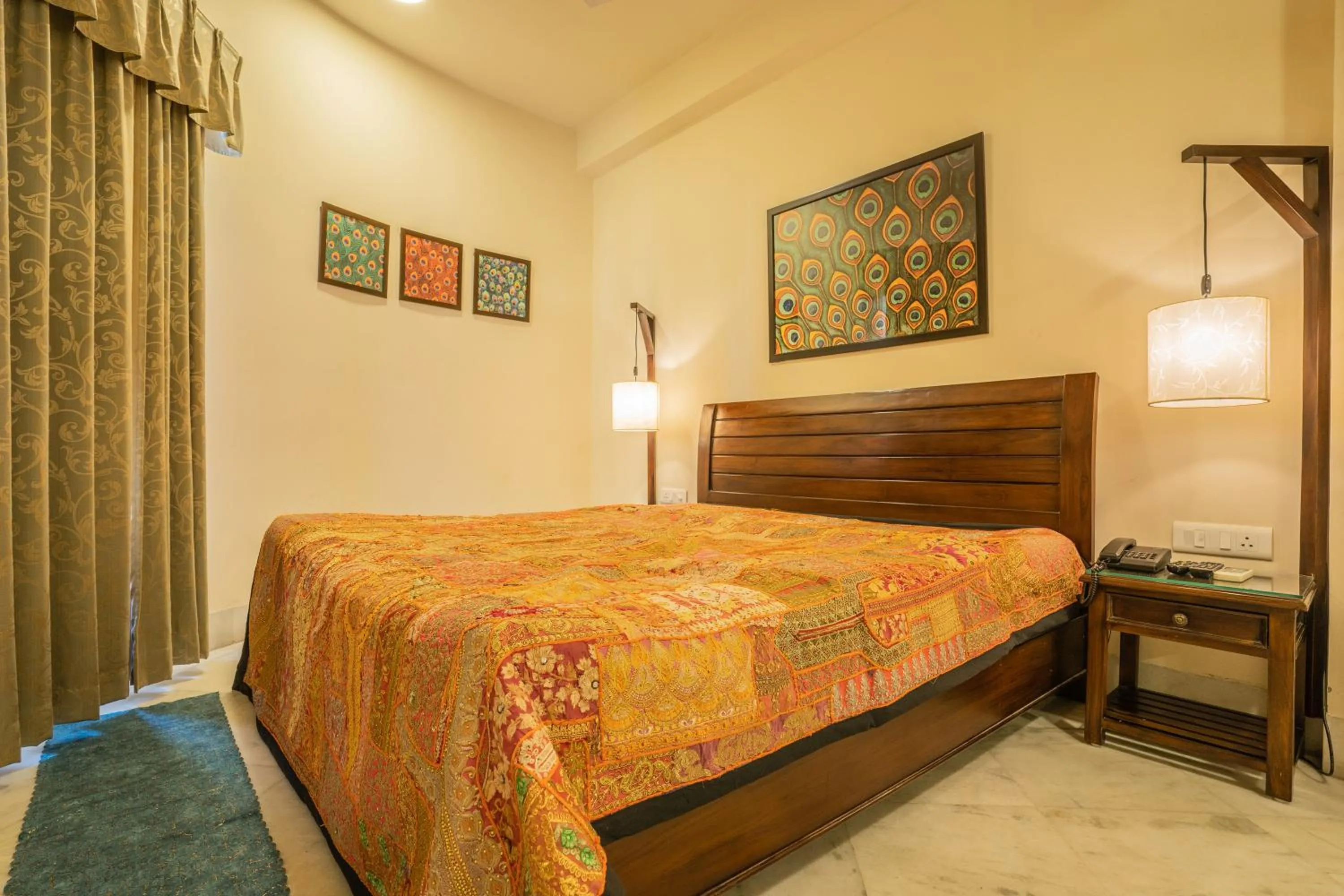 Bed in Tripli Hotels Shambhu Villas