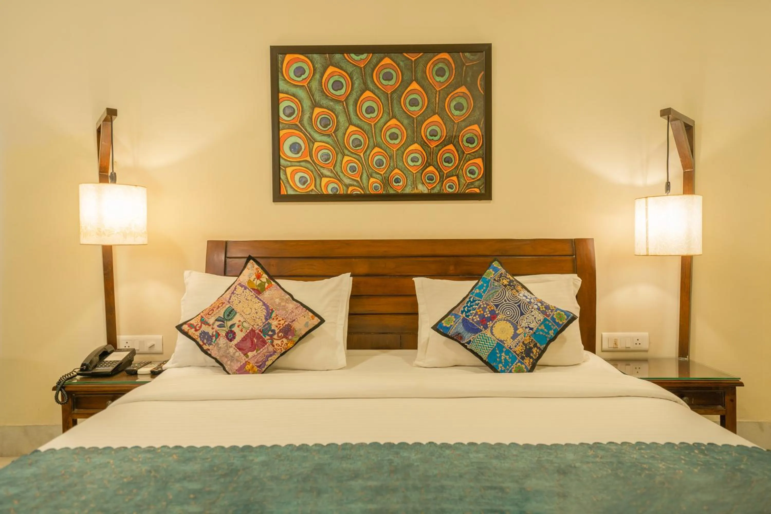 Bed in Tripli Hotels Shambhu Villas