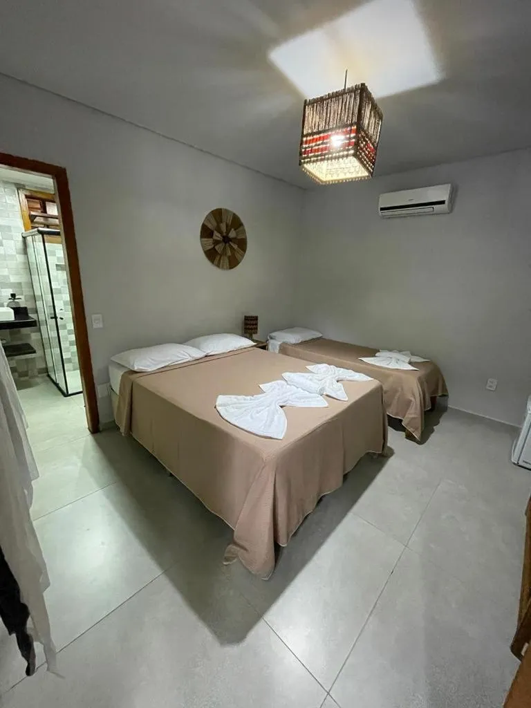 Photo of the whole room, Bed in Pousada Vilarejo
