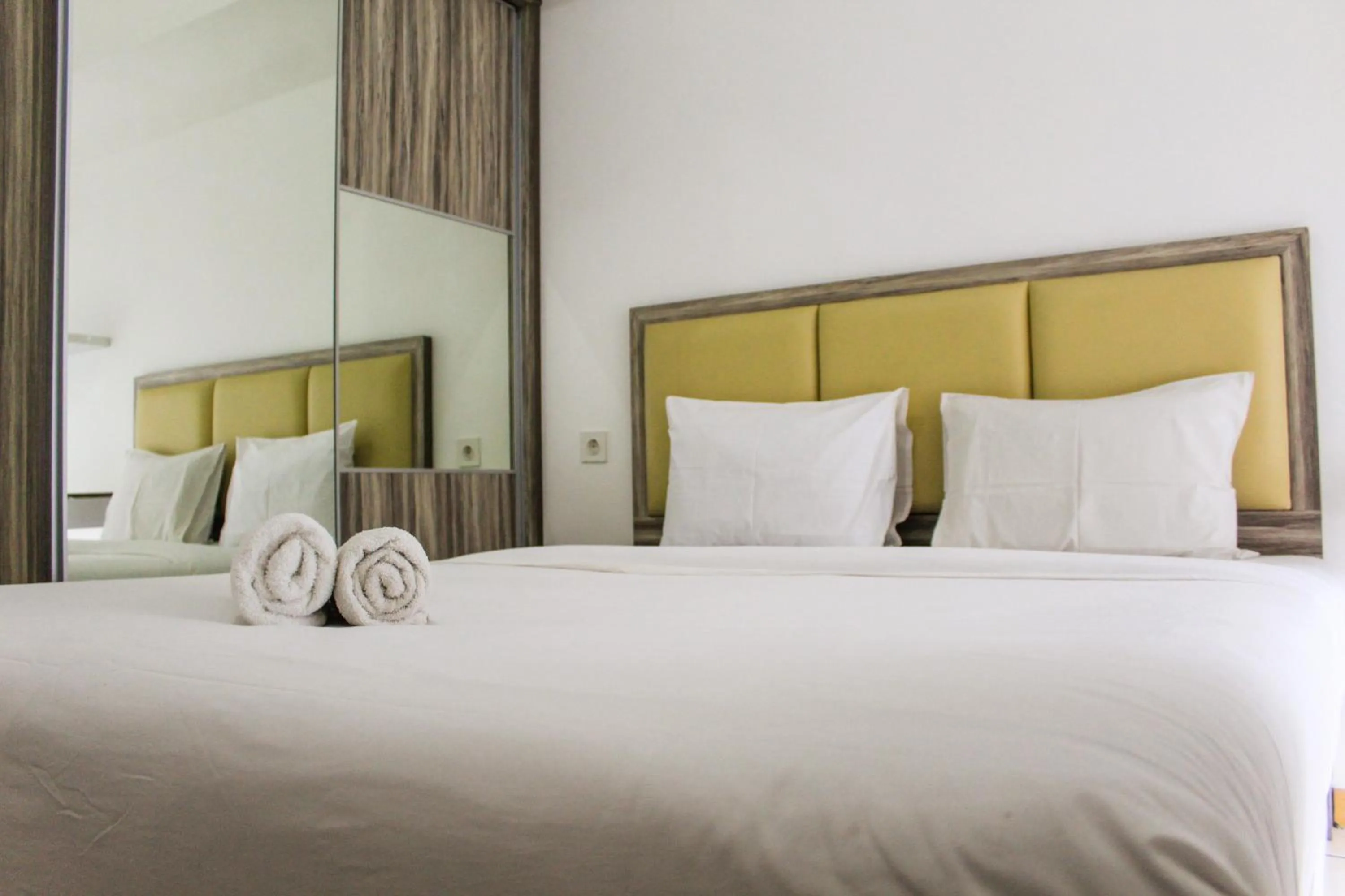 Bed in Relaxing 2BR Apartment at M-Town Residence By Travelio