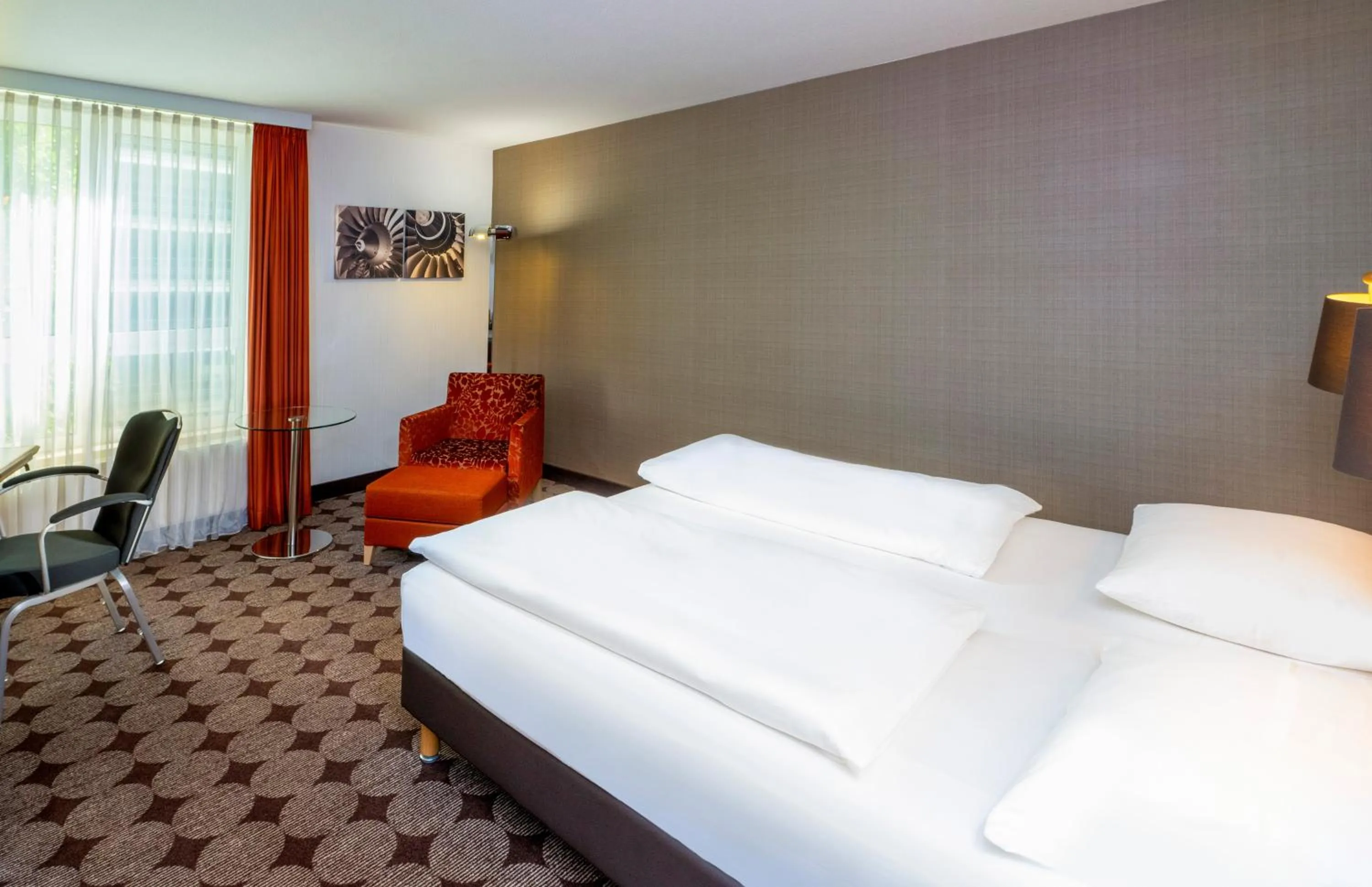 Photo of the whole room, Bed in Mövenpick Hotel Nürnberg Airport
