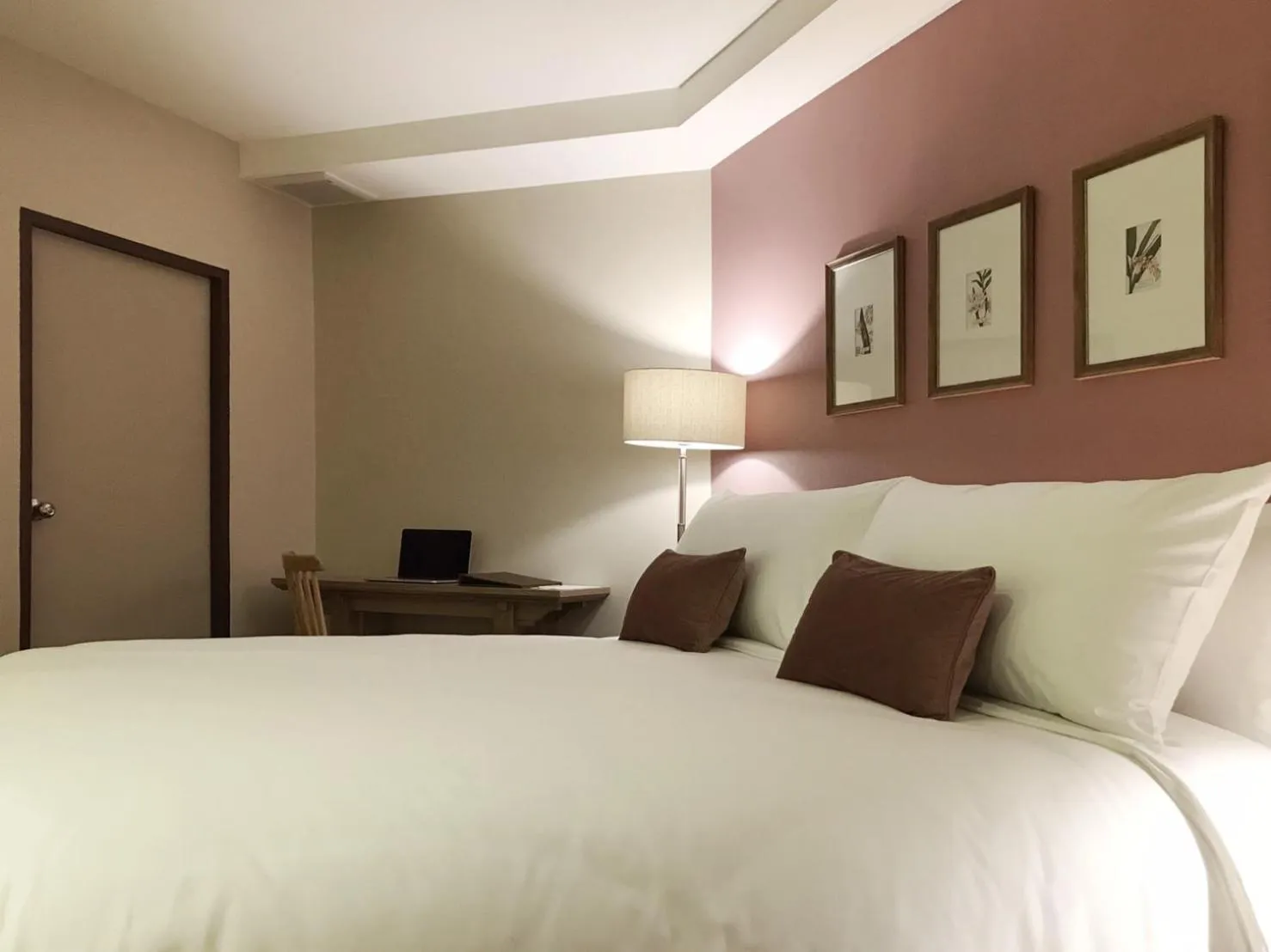 Bed in The Raintree Hotel Chiang Mai