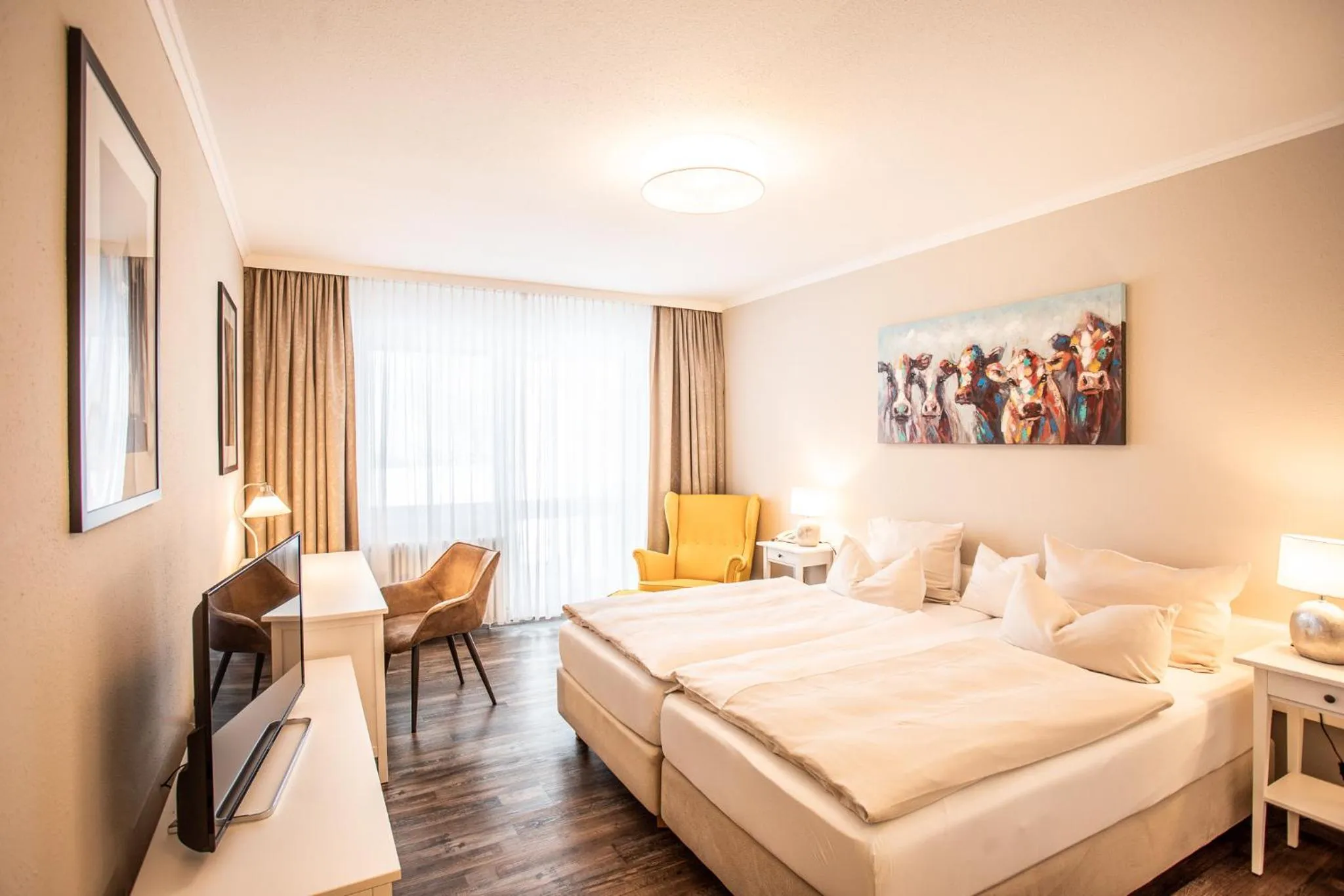 Photo of the whole room, Bed in Yachthotel Chiemsee GmbH