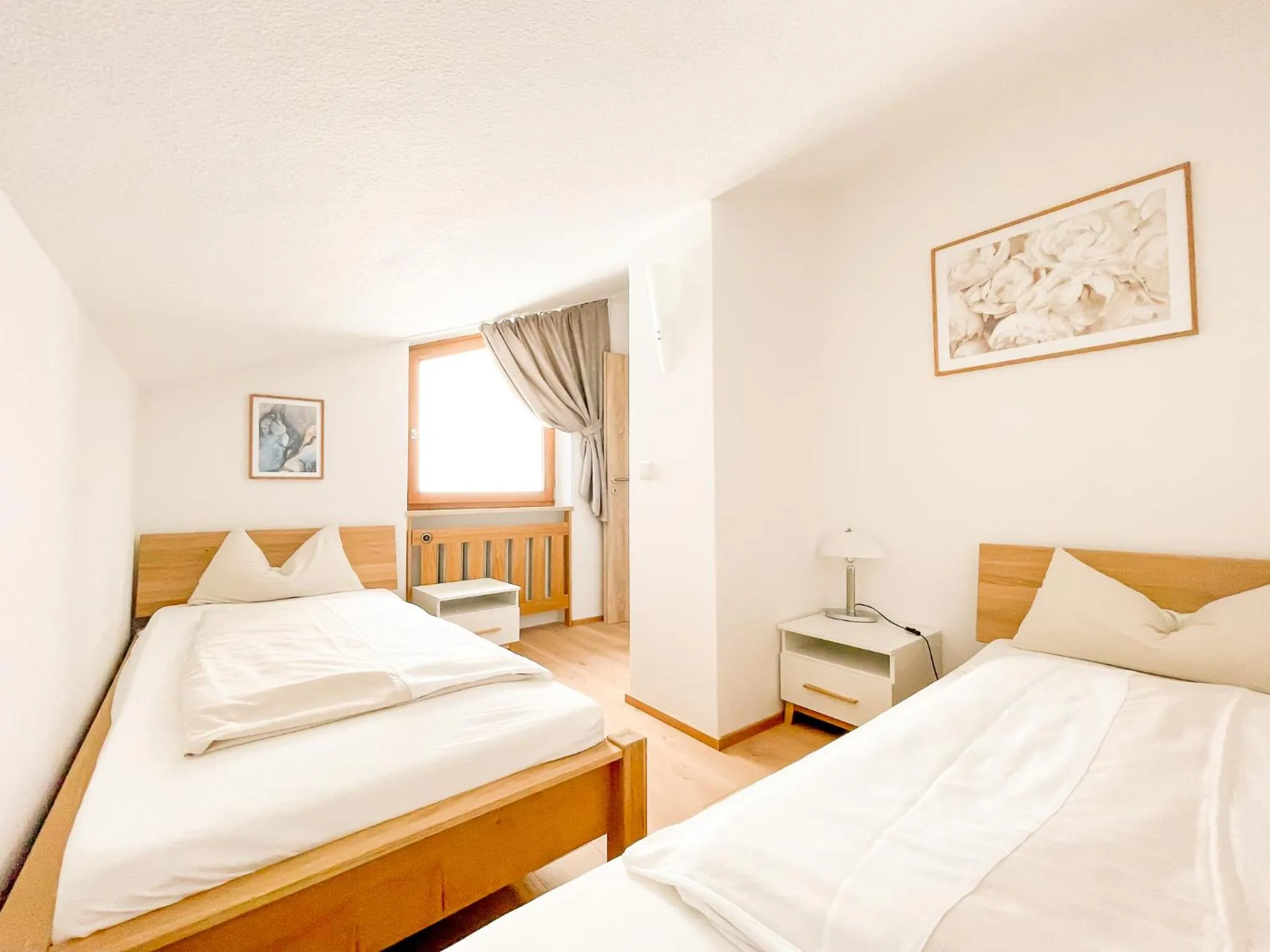 Photo of the whole room, Bed in Yachthotel Chiemsee GmbH