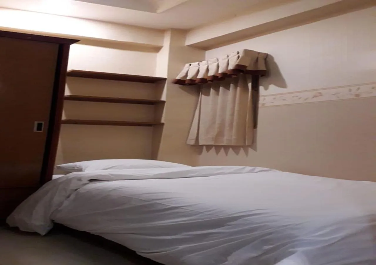 Bedroom, Bed in The suites Metro Apartment by Desta Farispro