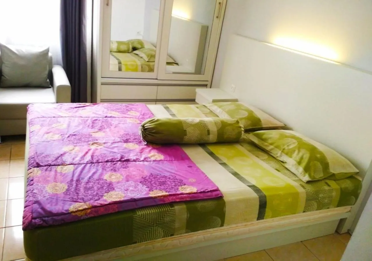 Bedroom, Bed in The suites Metro Apartment by Desta Farispro