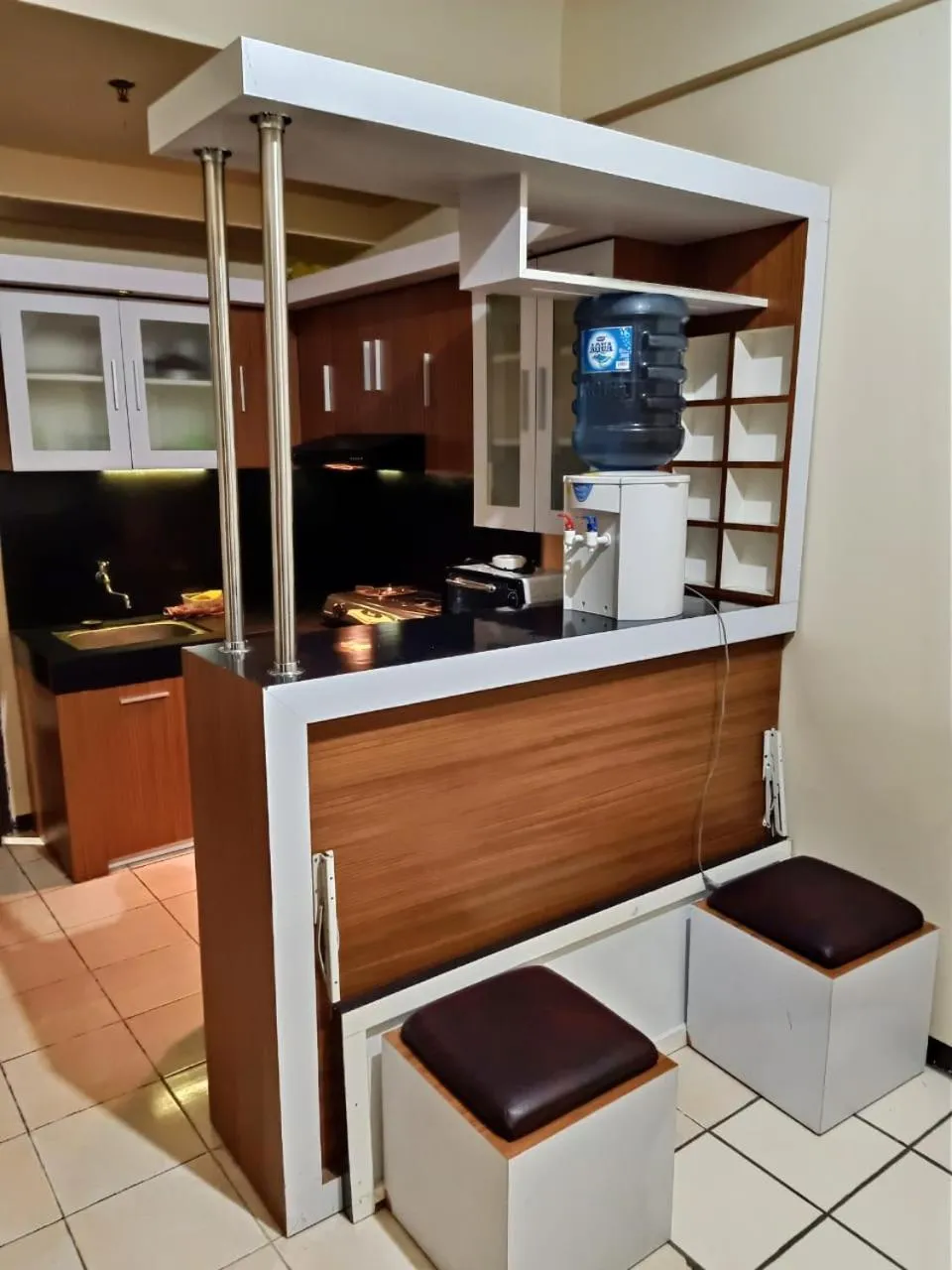 Kitchen or kitchenette in The suites Metro Apartment by Desta Farispro