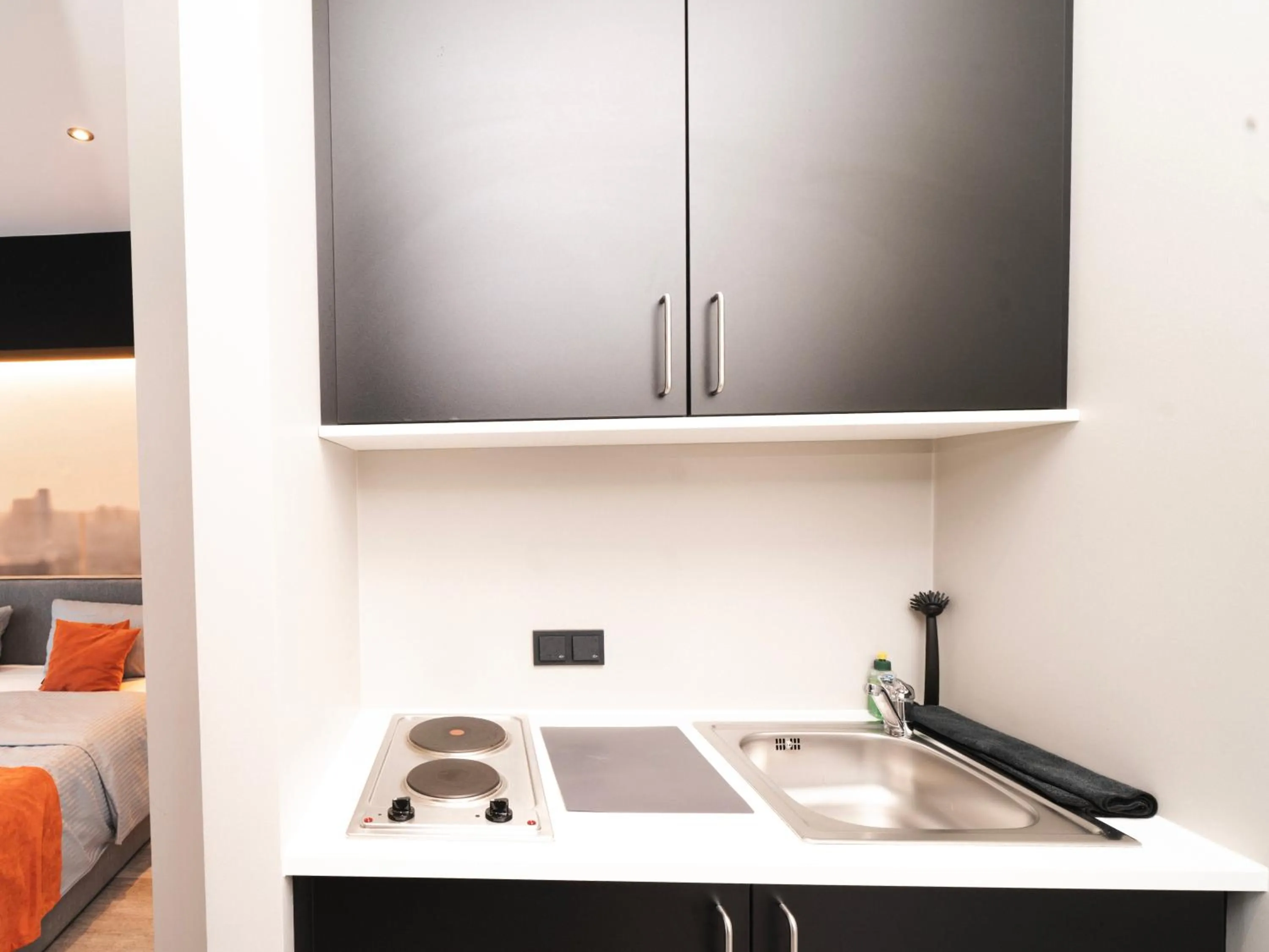 Kitchen or kitchenette in JustStay Grevenbroich Hotel & Apartments