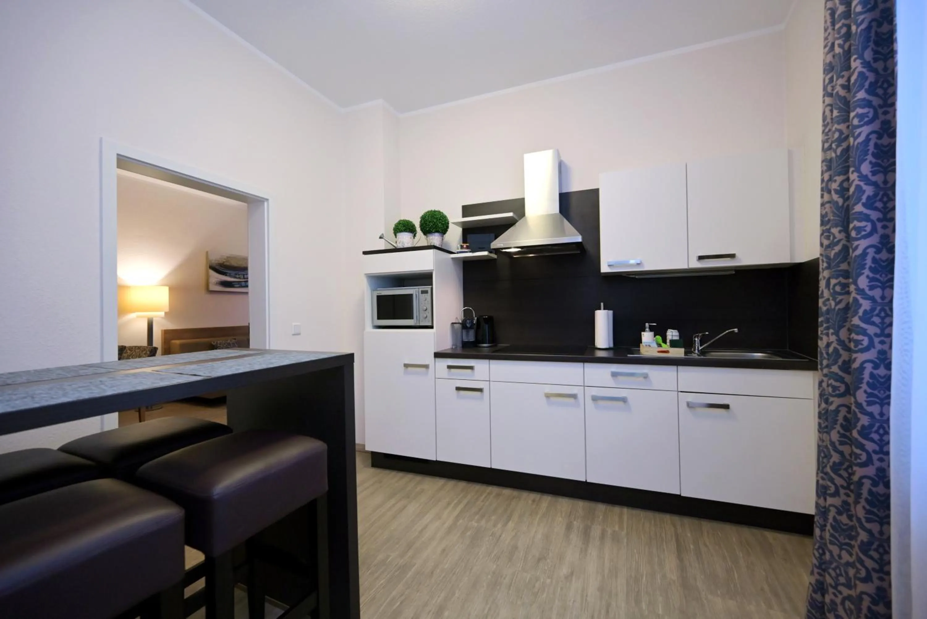Kitchen or kitchenette in Hotel & Living Am Wartturm - Hotel & Apartments