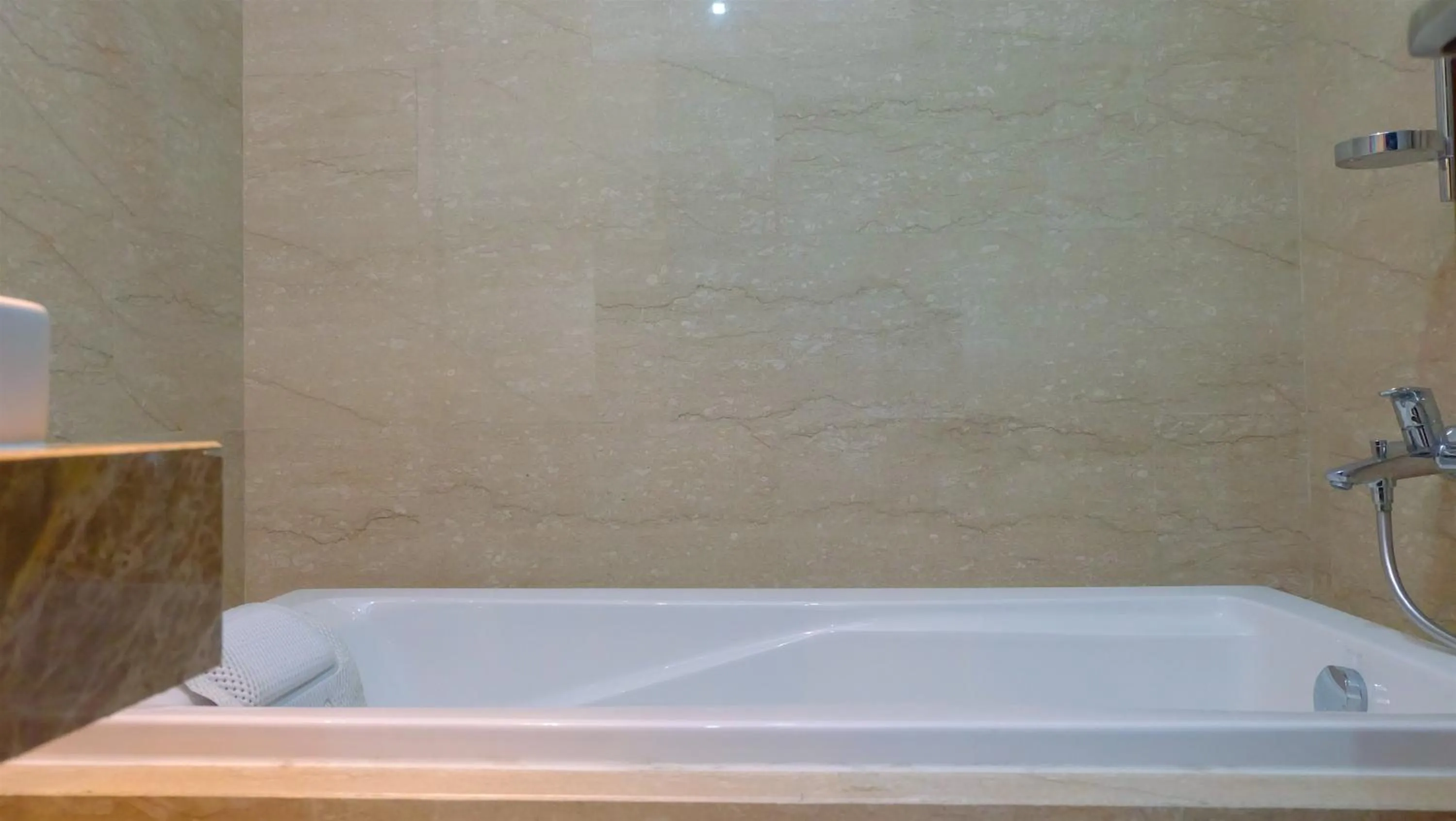 Bathroom in Classy 2BR Apartment at Menteng Park with City View By Travelio