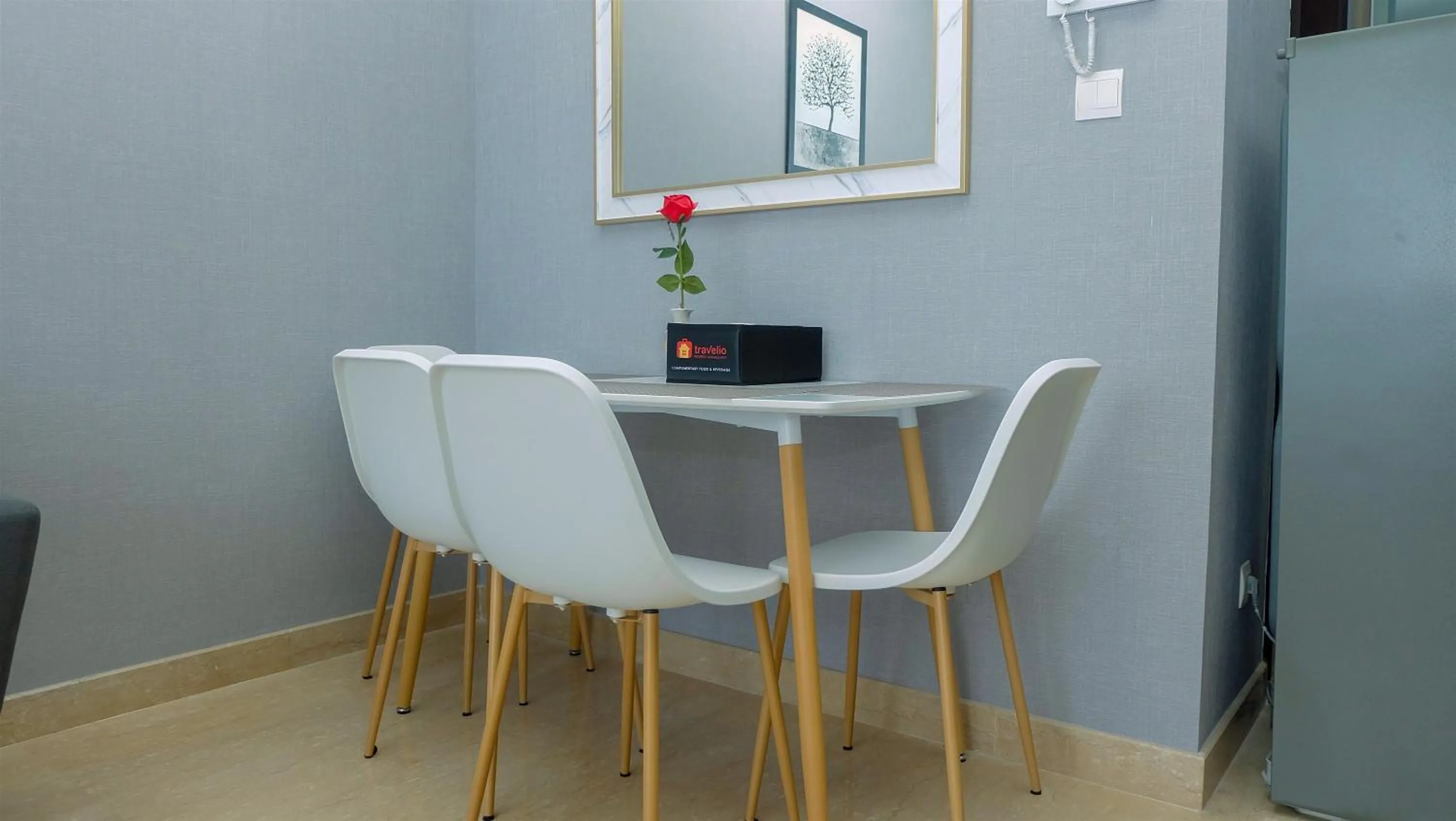 Dining area in Classy 2BR Apartment at Menteng Park with City View By Travelio