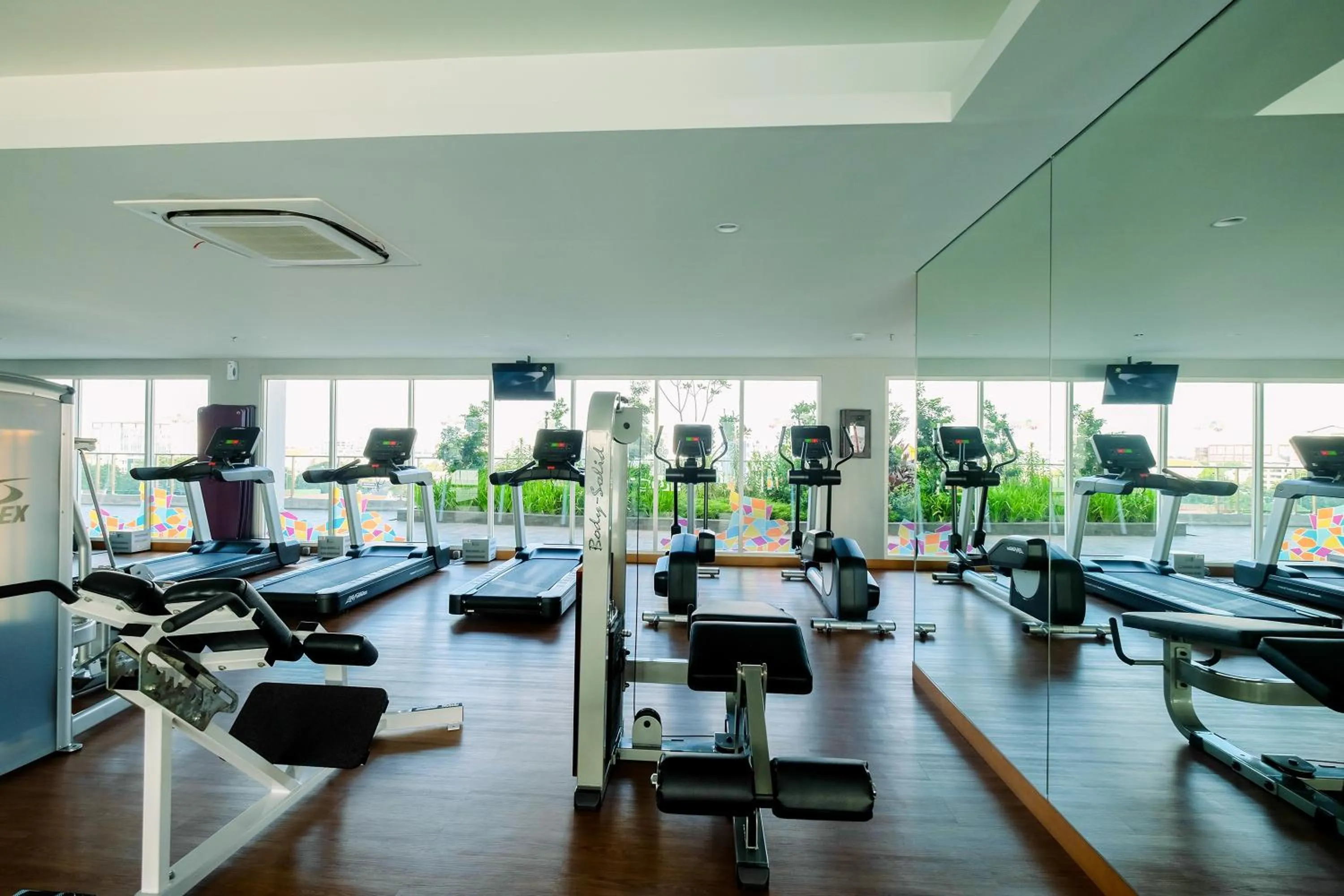 Fitness centre/facilities in Classy 2BR Apartment at Menteng Park with City View By Travelio