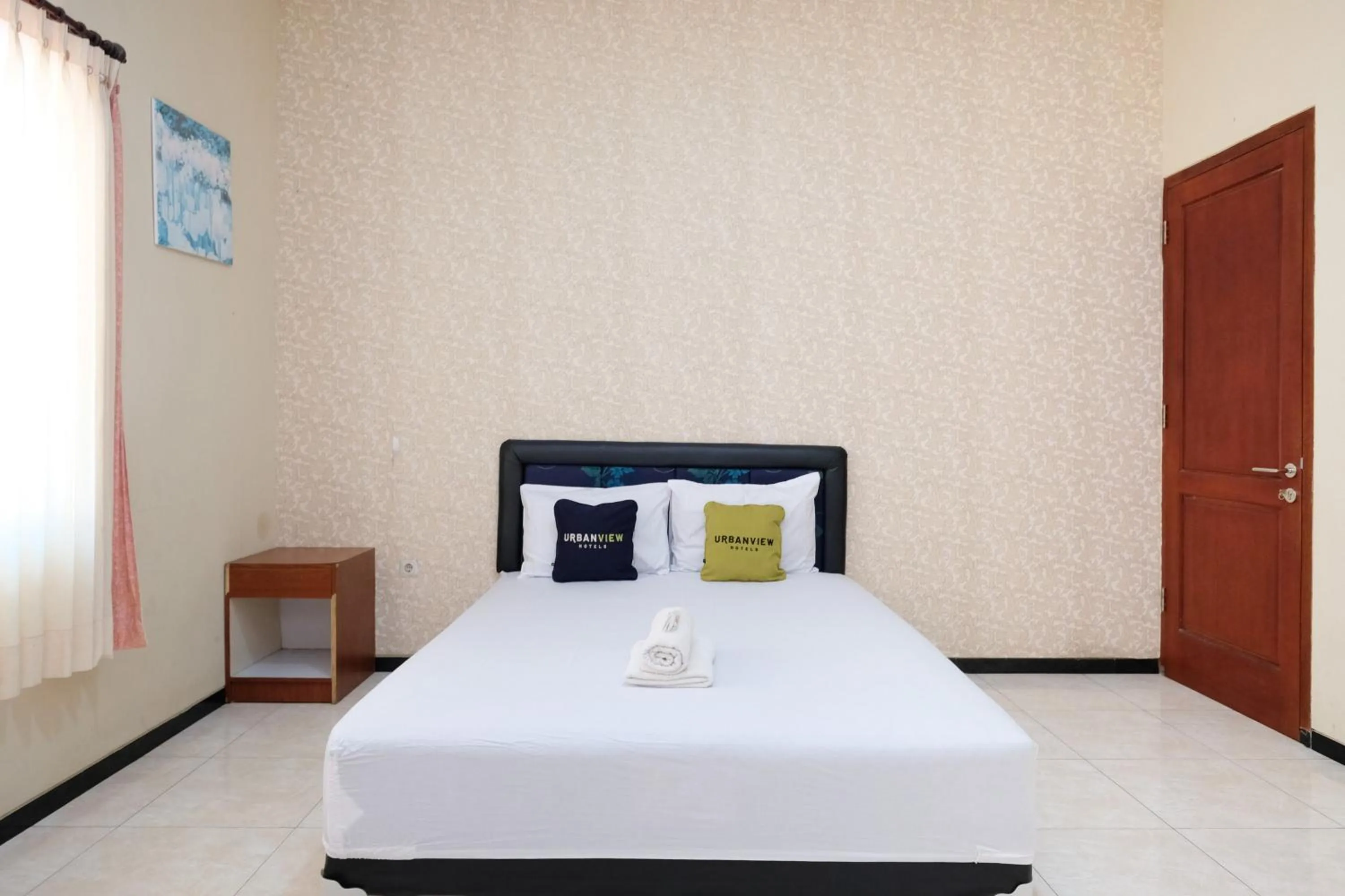 Bedroom, Bed in Urbanview Hotel Griya Surya Malang by RedDoorz