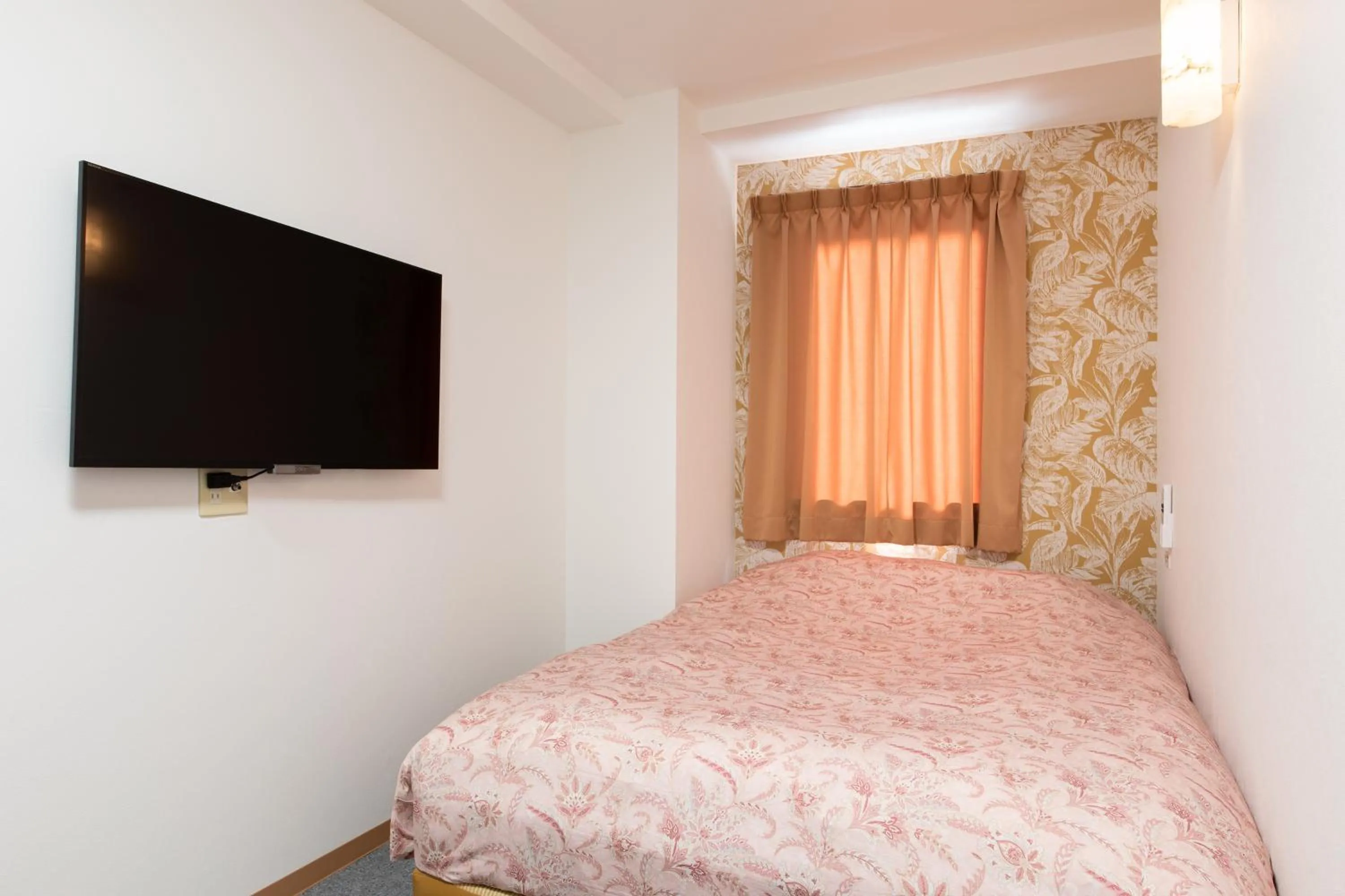 Bed in Otsuka Town Hotel