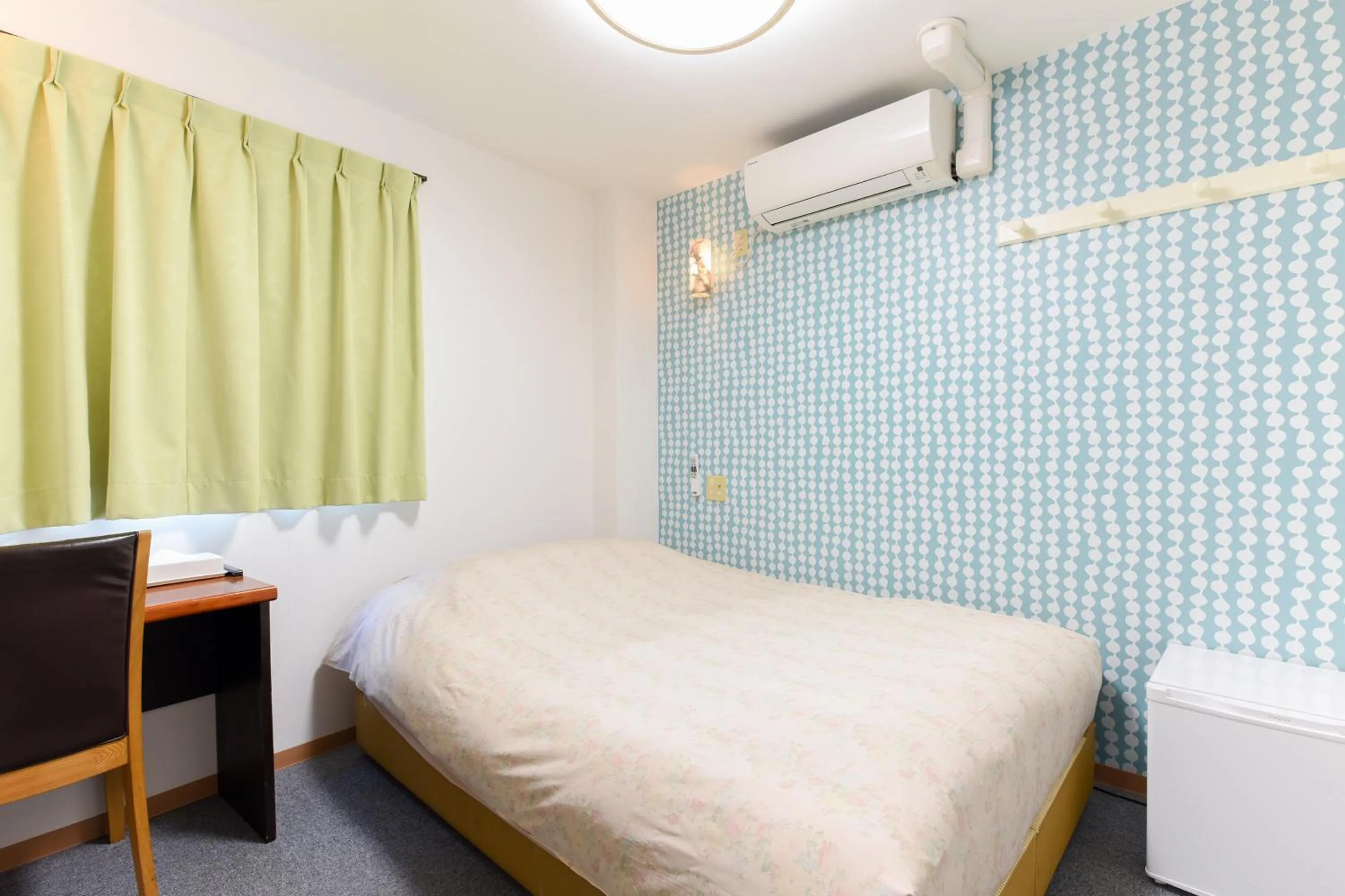 Bed in Otsuka Town Hotel