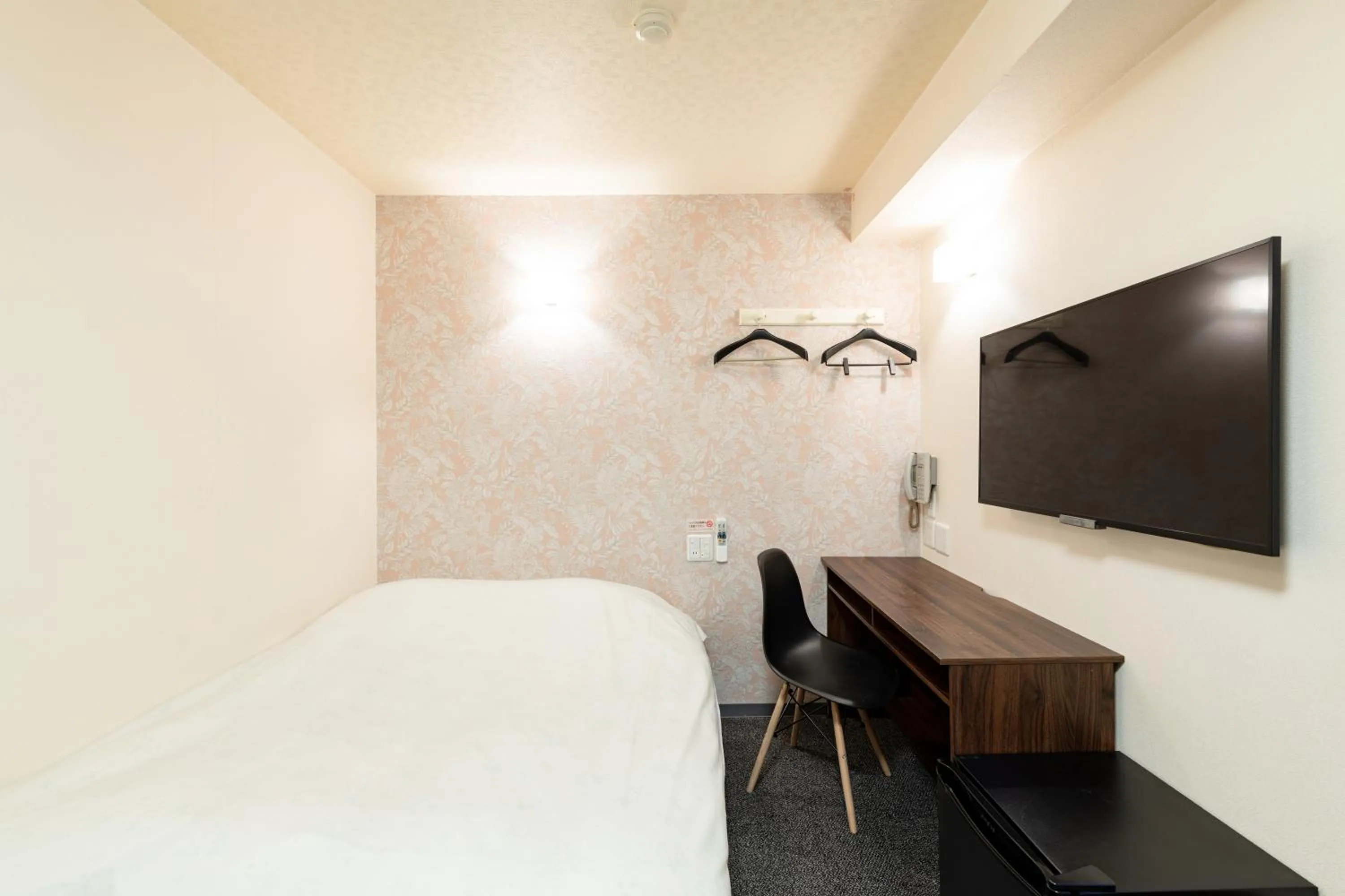 Bed in Toyama Town Hotel