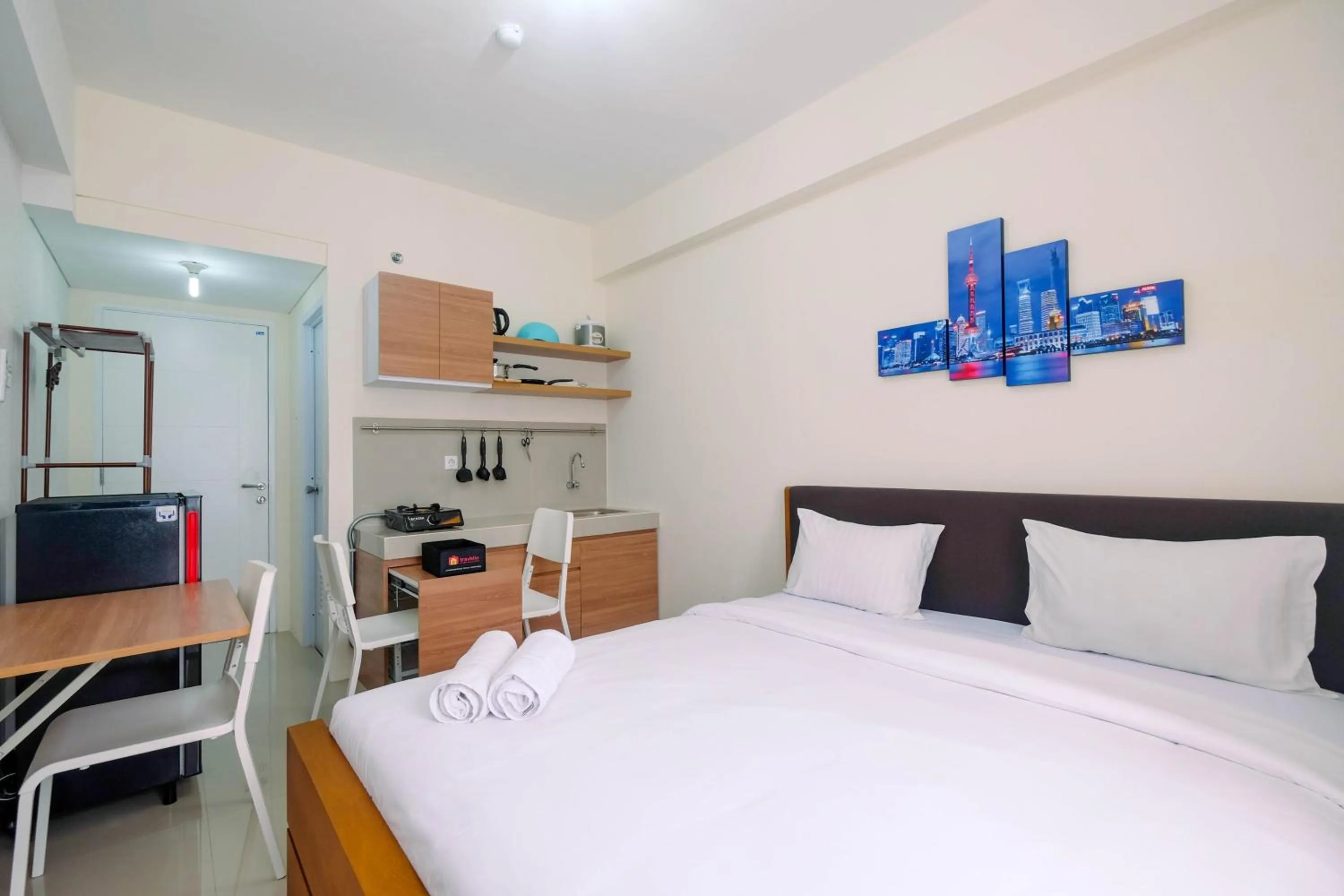 Bed in Homey Studio Apartment at Bogorienze By Travelio