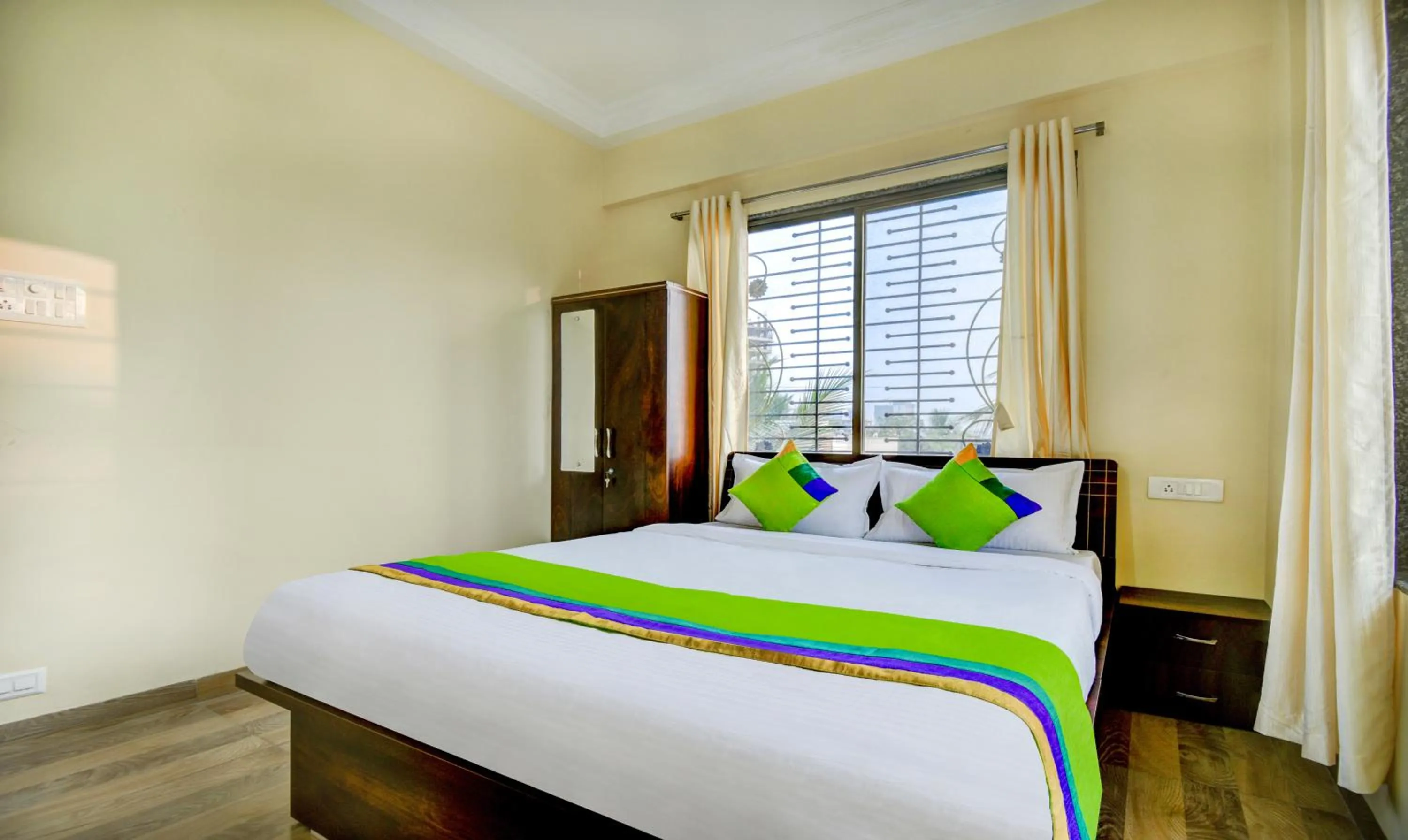 Bed in Treebo Sayaji Residency