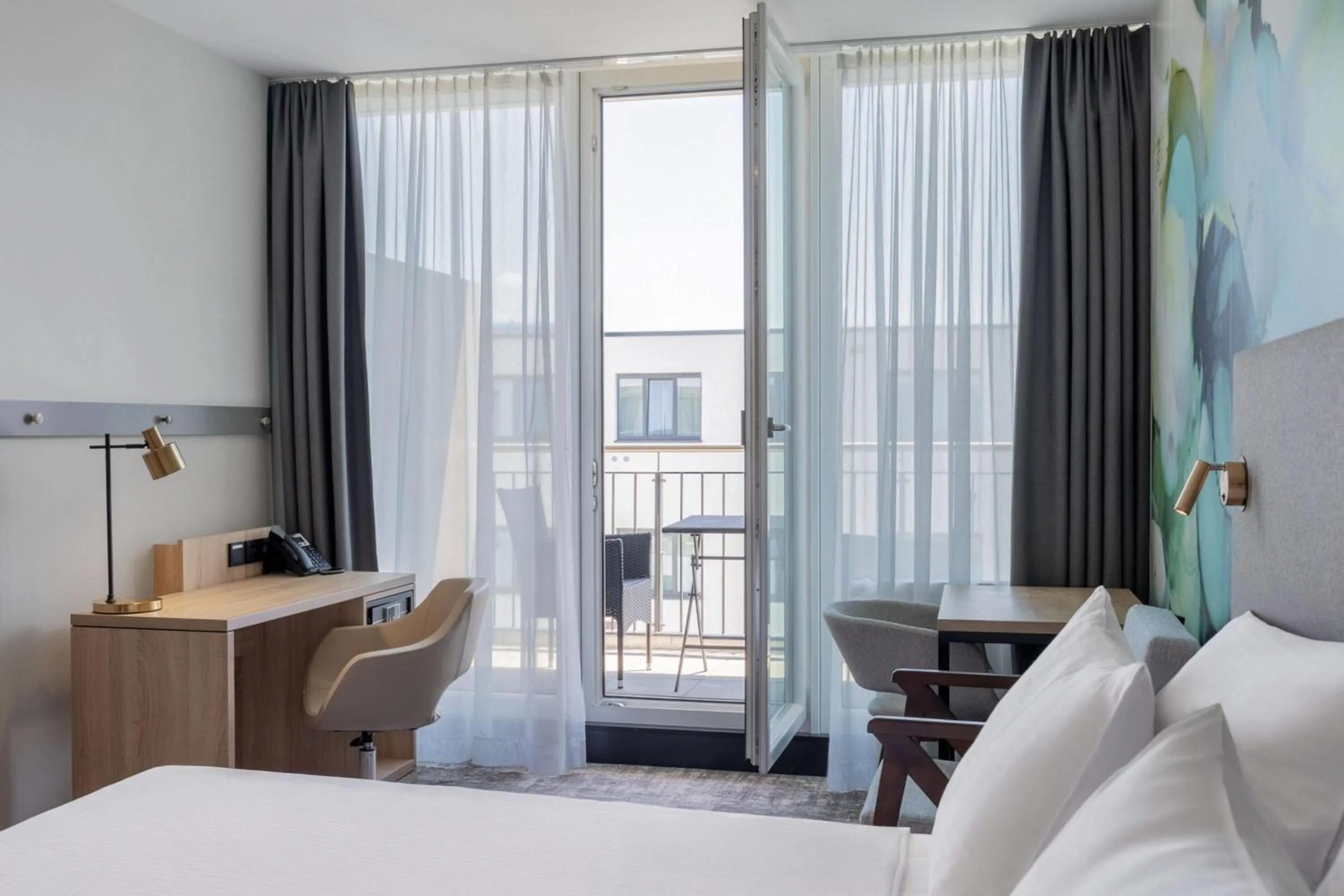 Photo of the whole room, Bed in Wyndham Garden Munich Messe