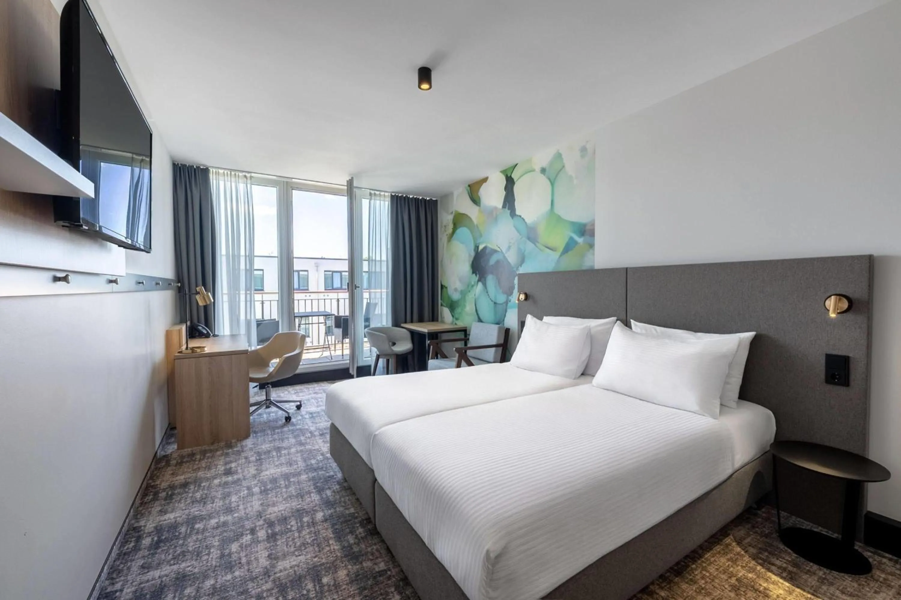 Photo of the whole room, Bed in Wyndham Garden Munich Messe