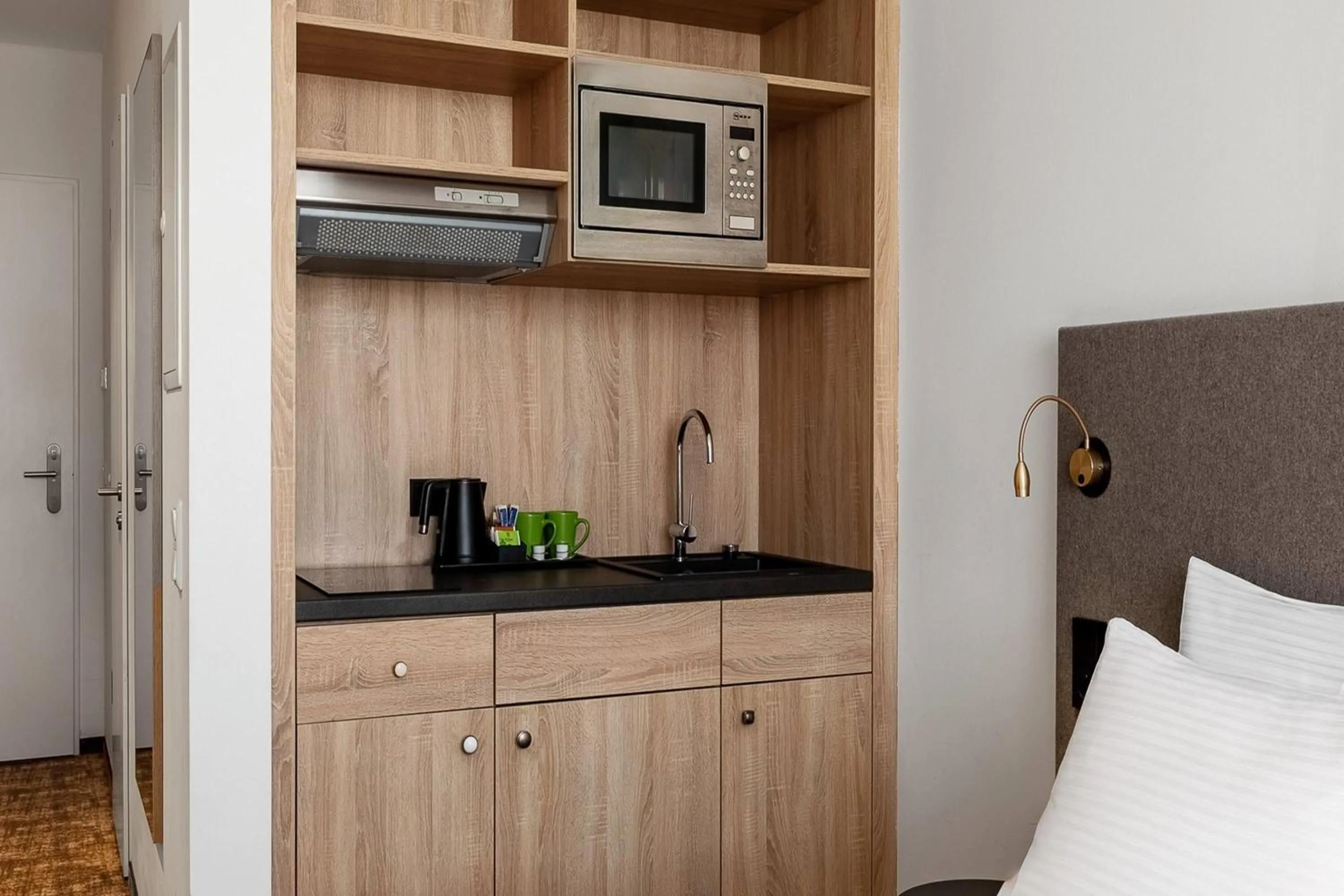 Photo of the whole room, Bed in Wyndham Garden Munich Messe