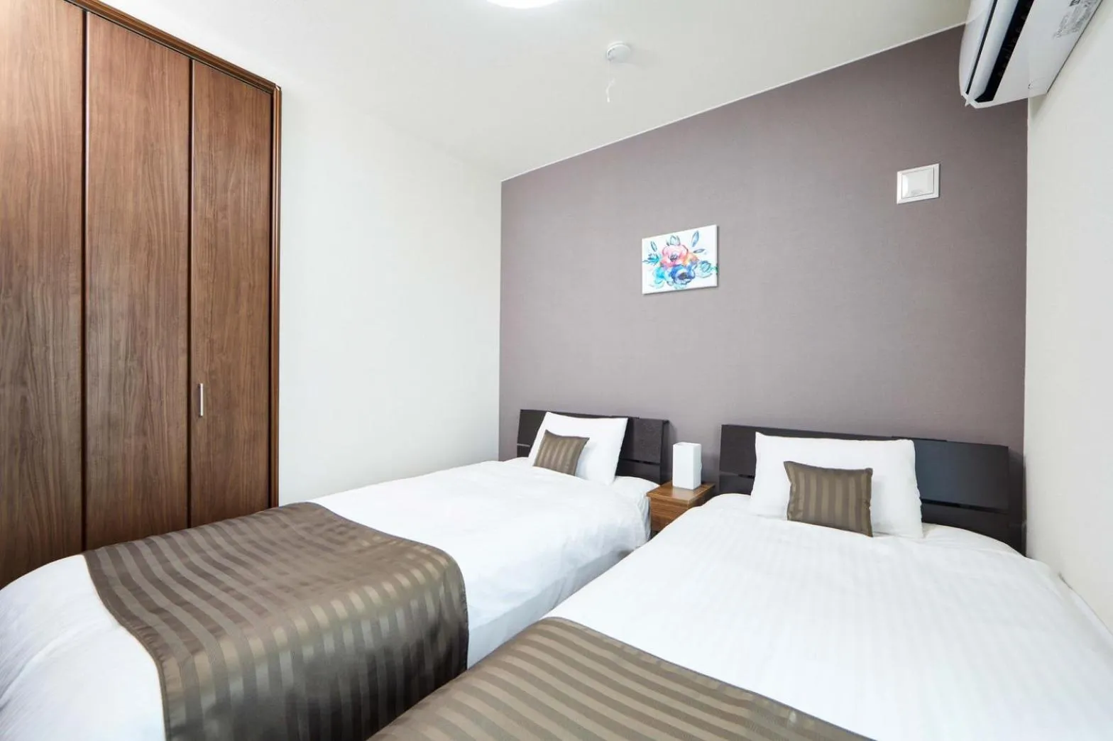 Bed in E-horizon Resort コンドミニアム名護D