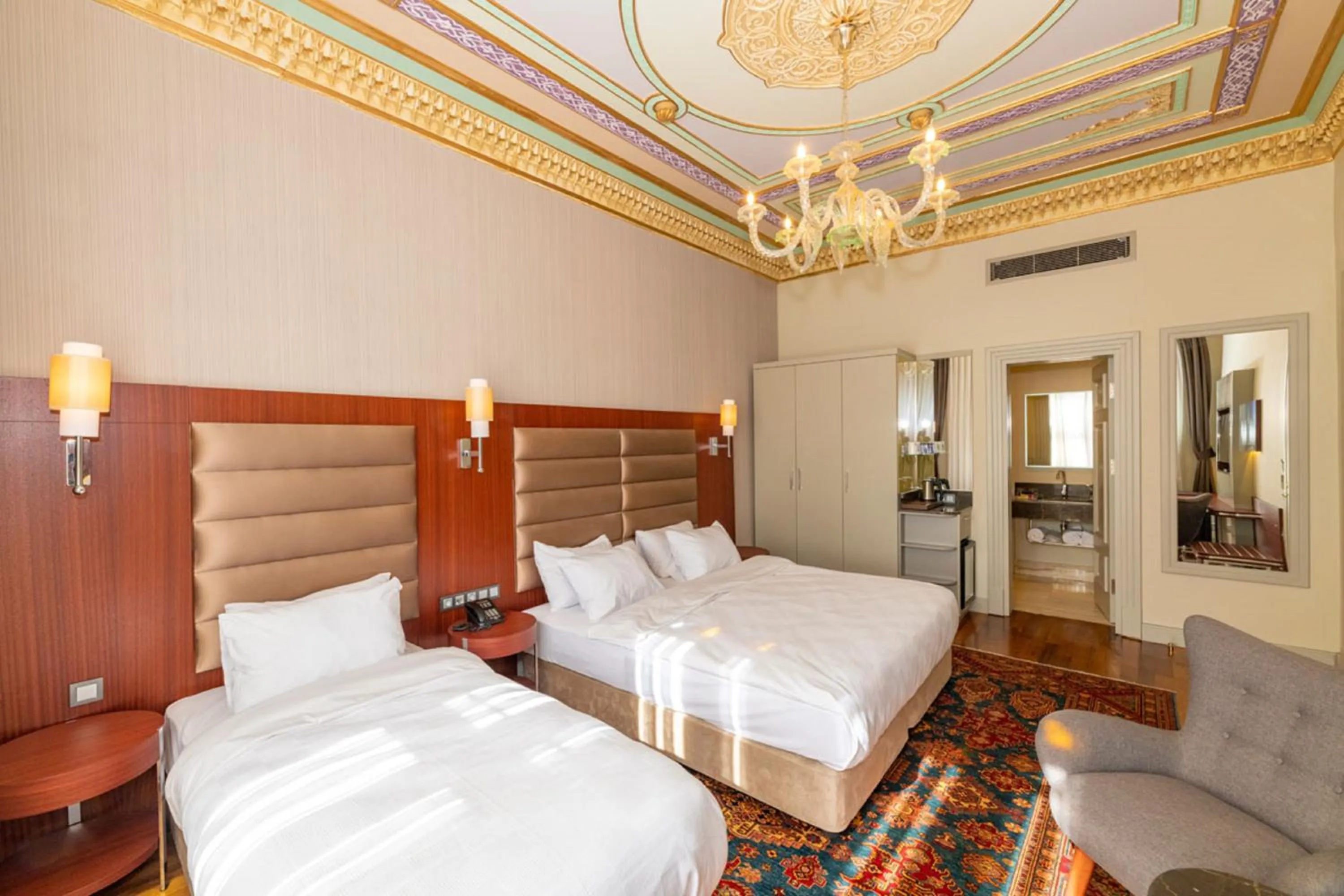 Bed in Blue Gilroy Hotel