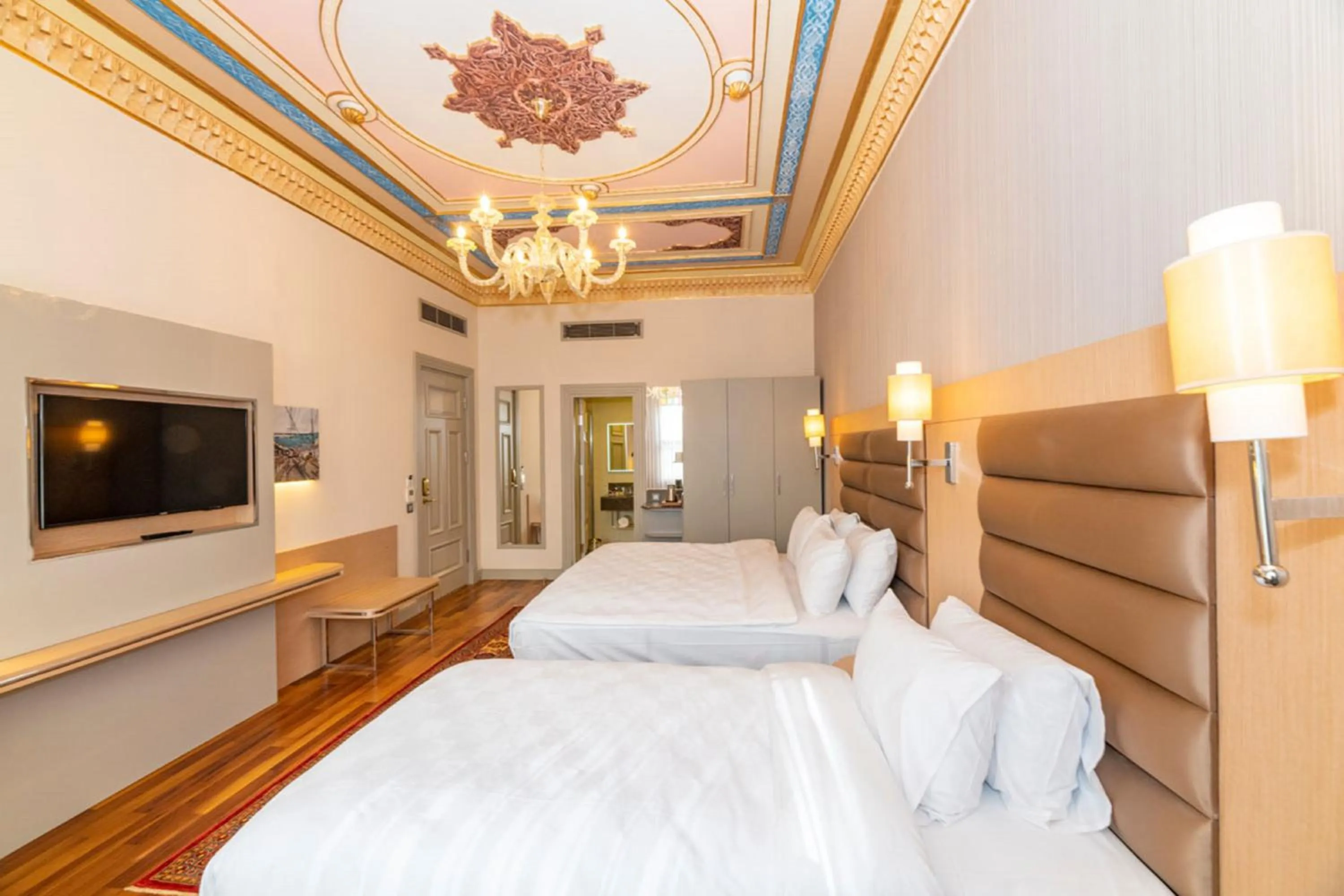 Bed in Blue Gilroy Hotel