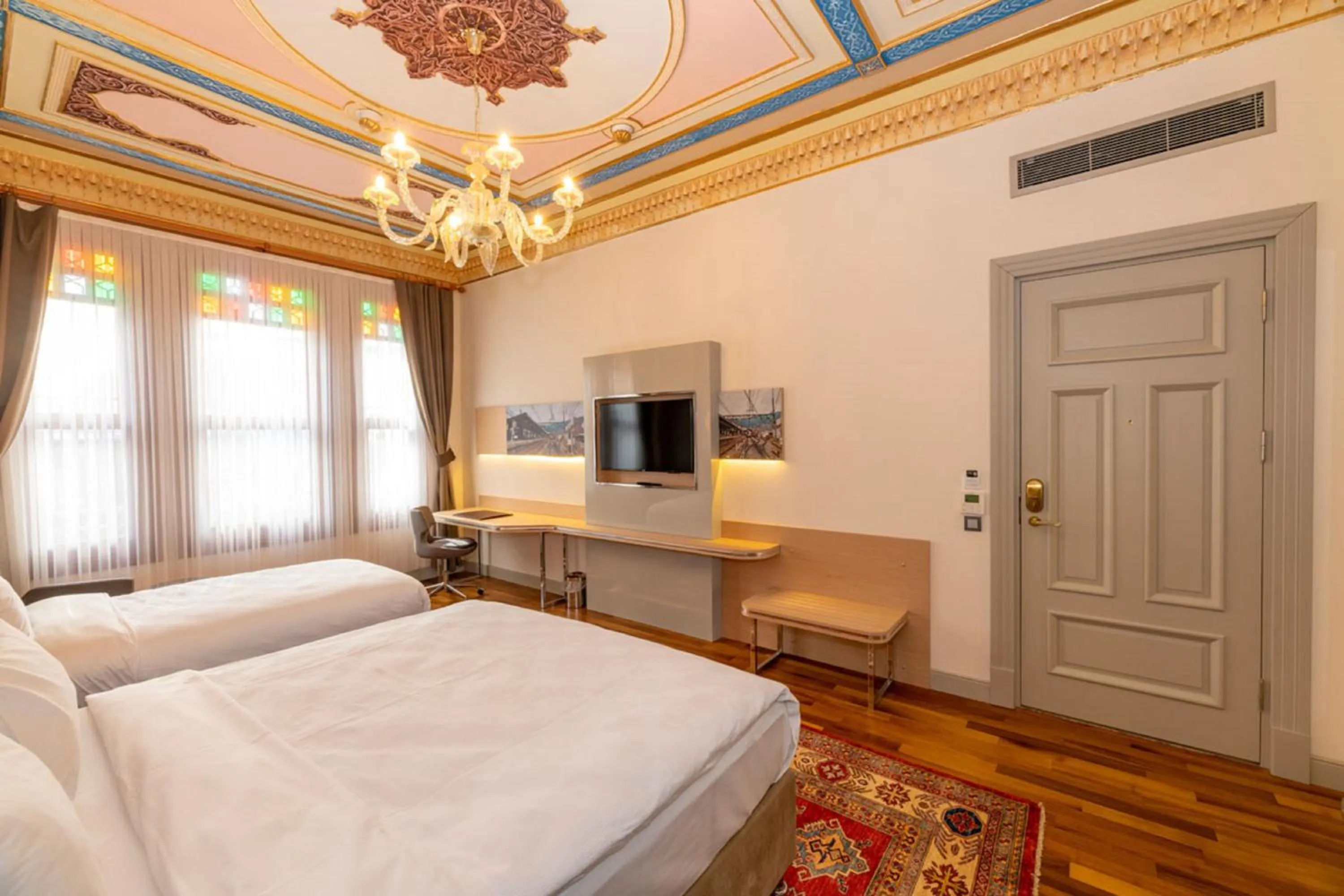 Bed in Blue Gilroy Hotel