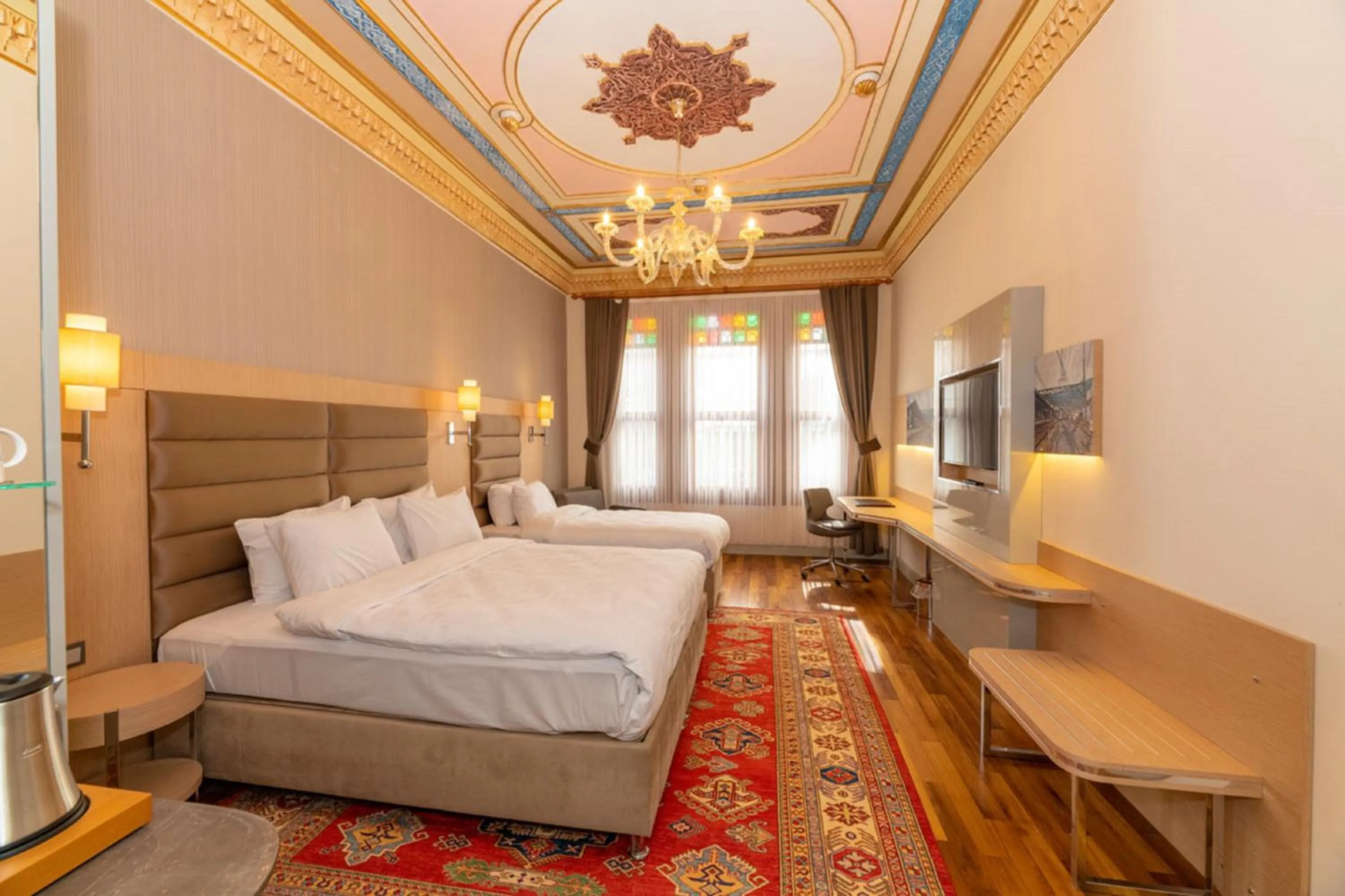 Bed in Blue Gilroy Hotel