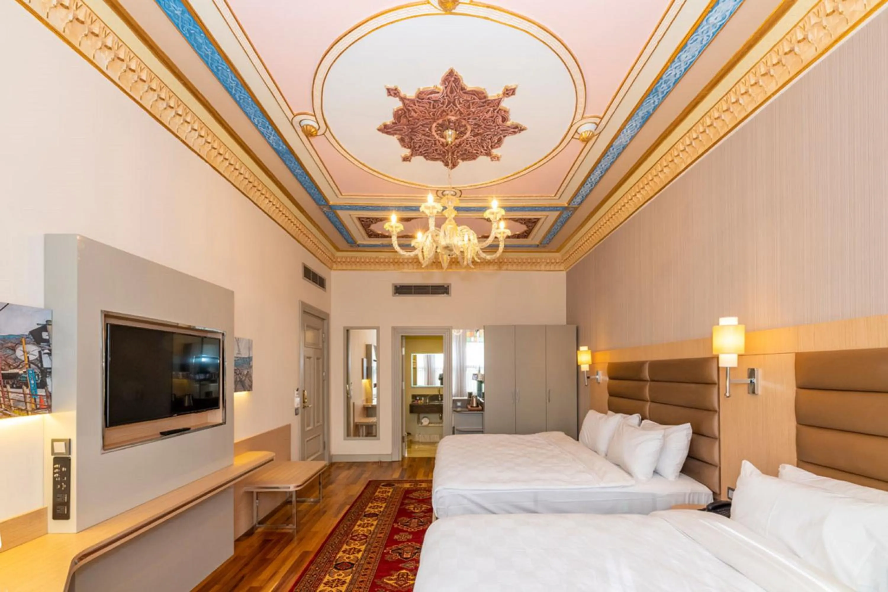 Bed in Blue Gilroy Hotel