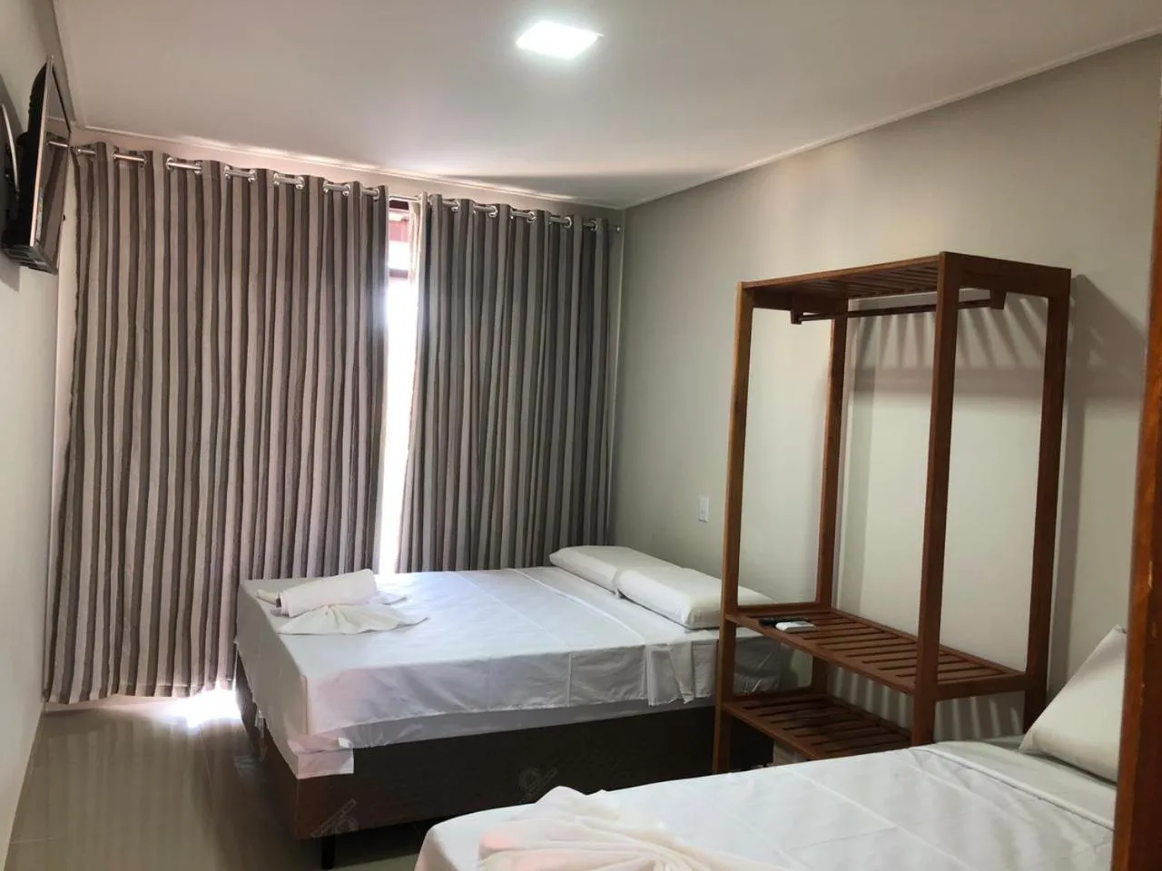 Bed in Pousada Veleiro