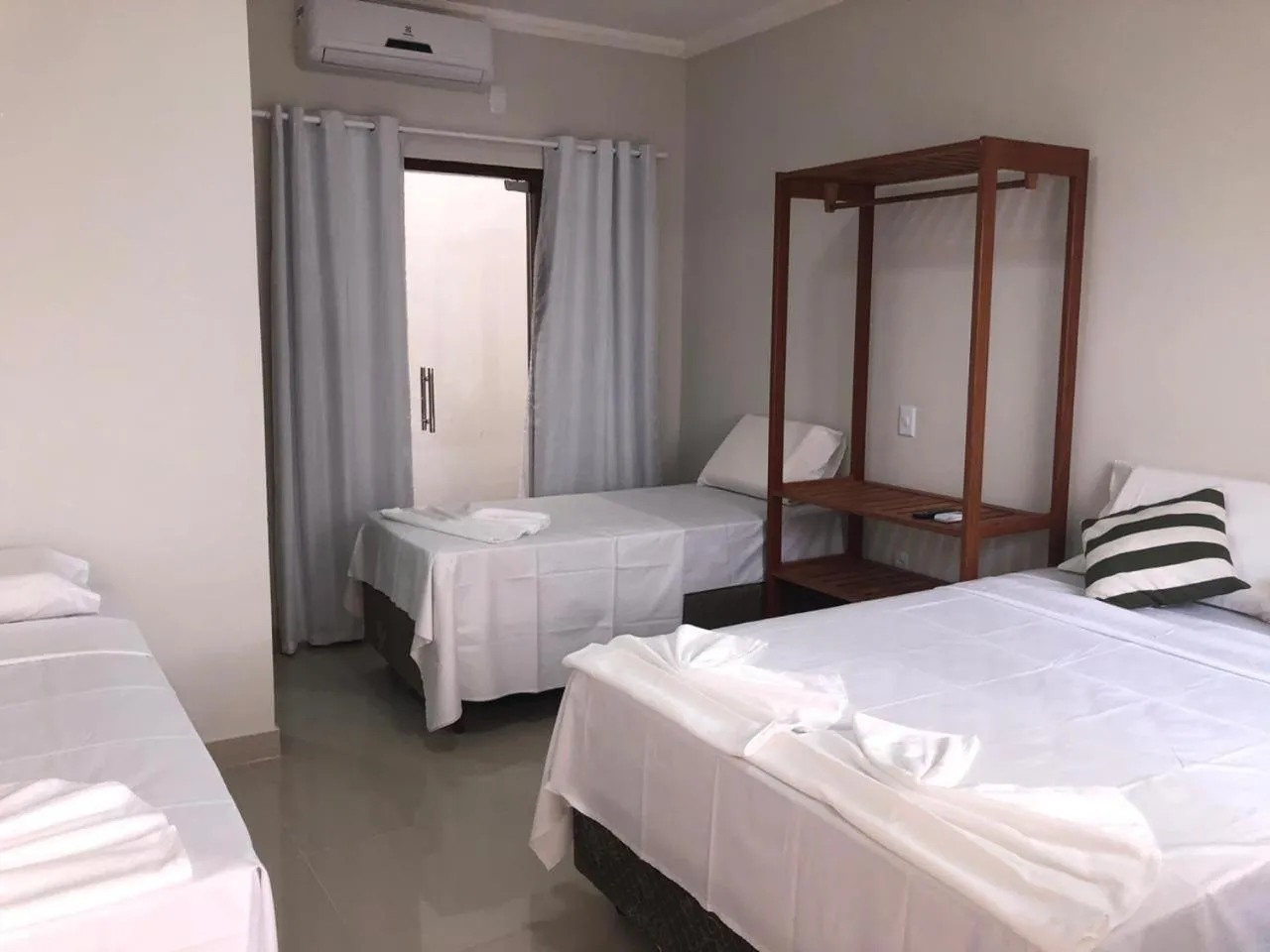 Bed in Pousada Veleiro