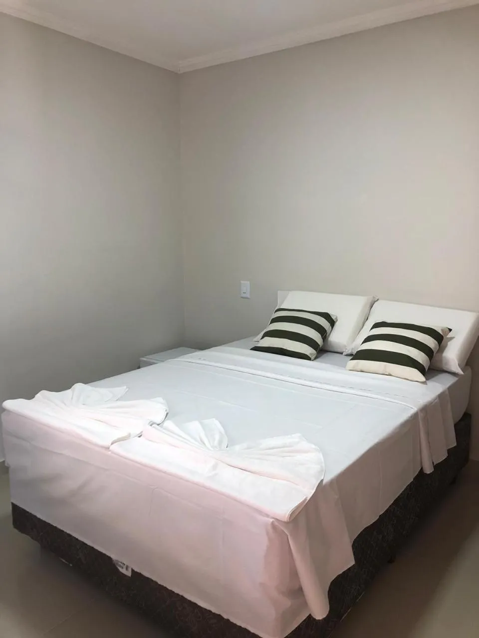 Bed in Pousada Veleiro