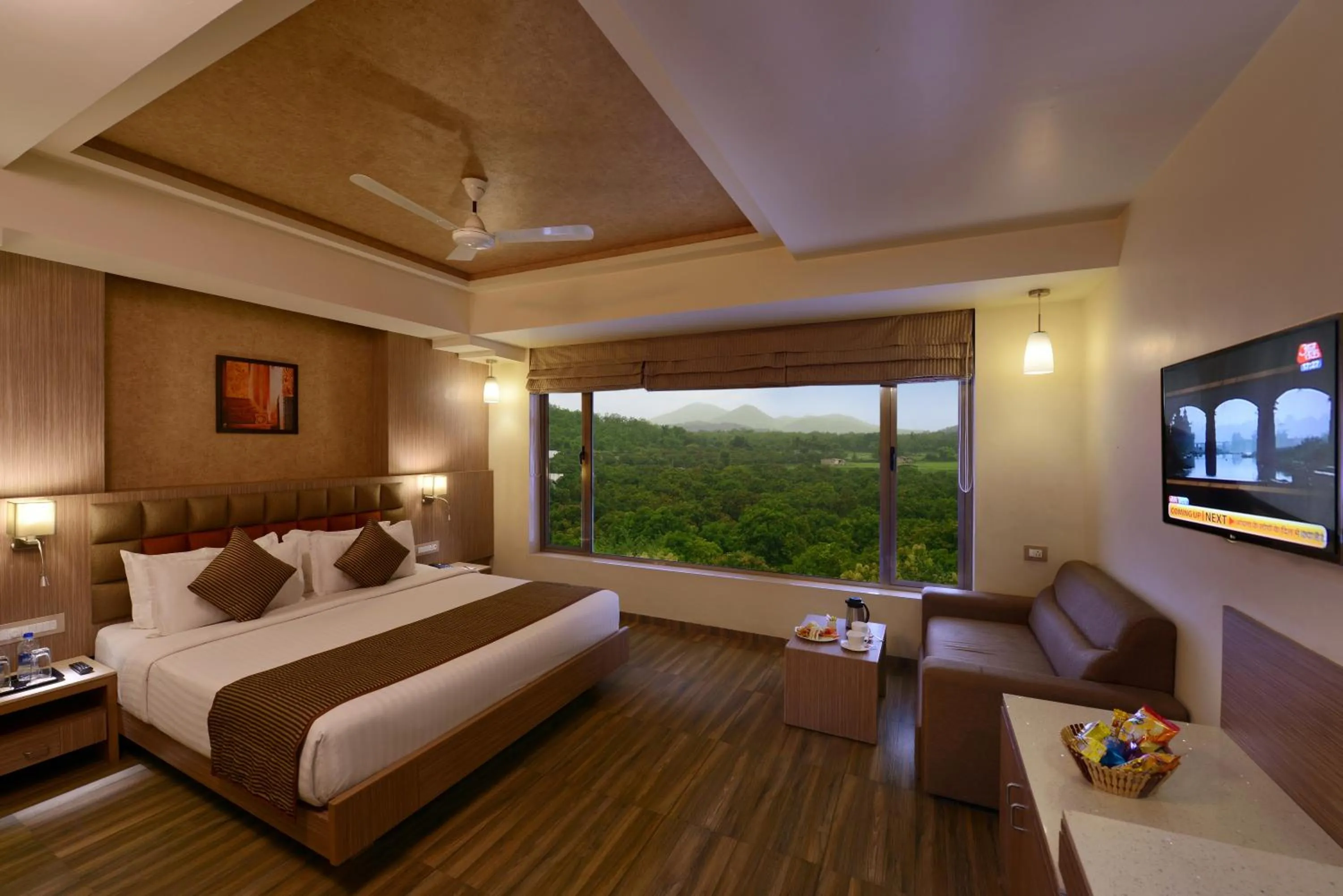 Photo of the whole room, Bed in Sarovar Portico Sasangir