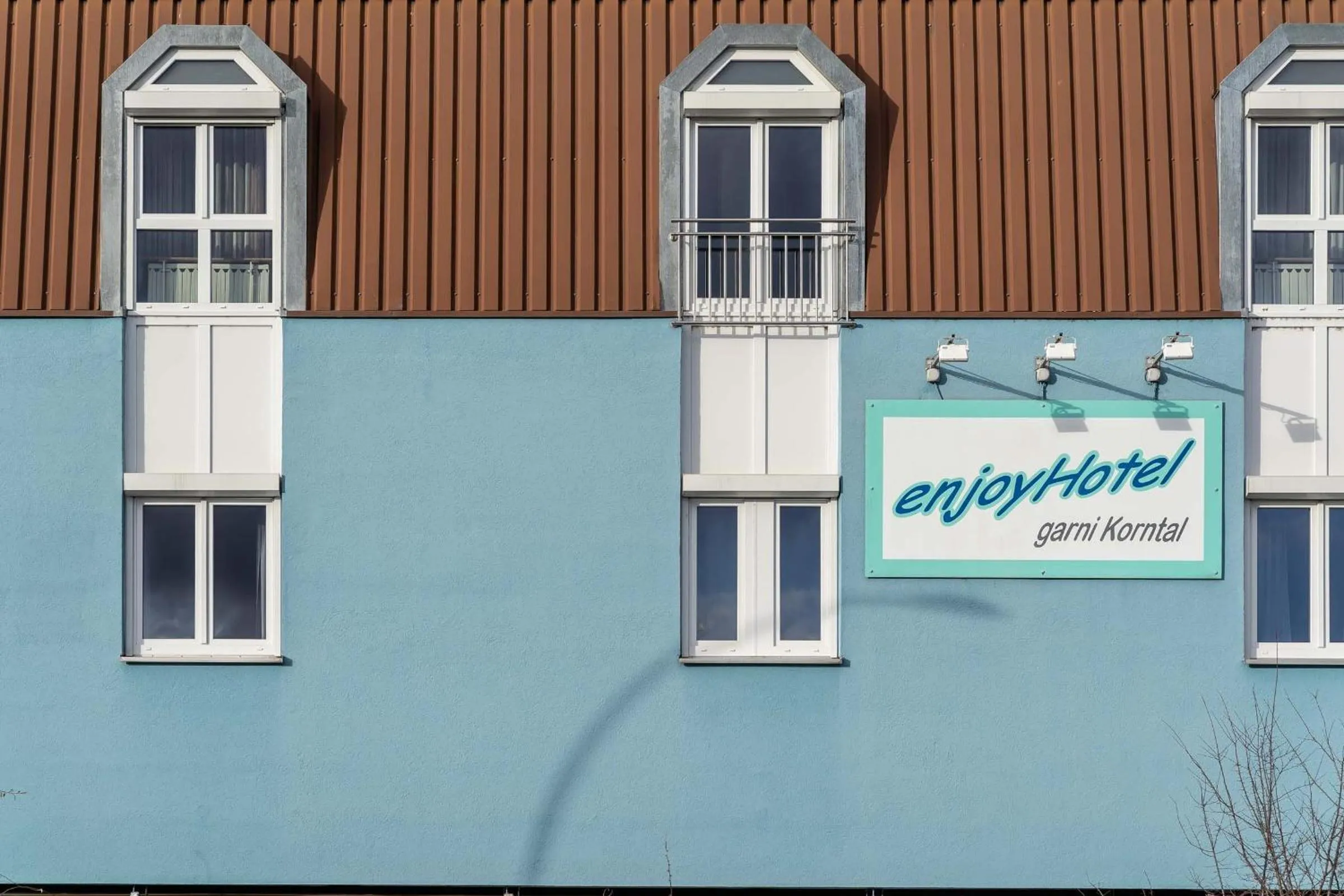 Property logo or sign in enjoyHotel garni Korntal Stuttgart b&b Parkplatz Sprinter Penny eTank