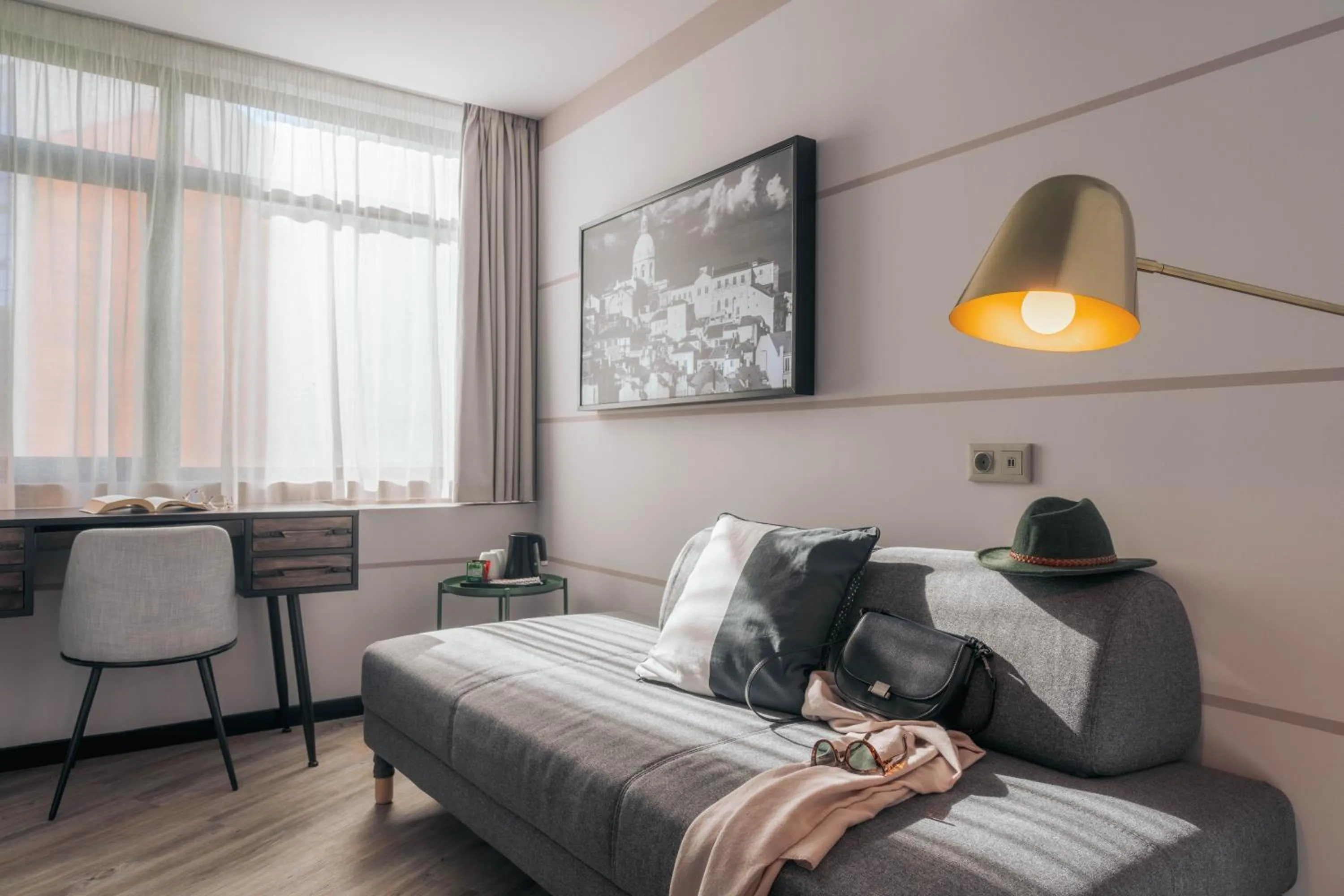 Seating area, Bed in Pestana Lisboa Vintage City Center Suites