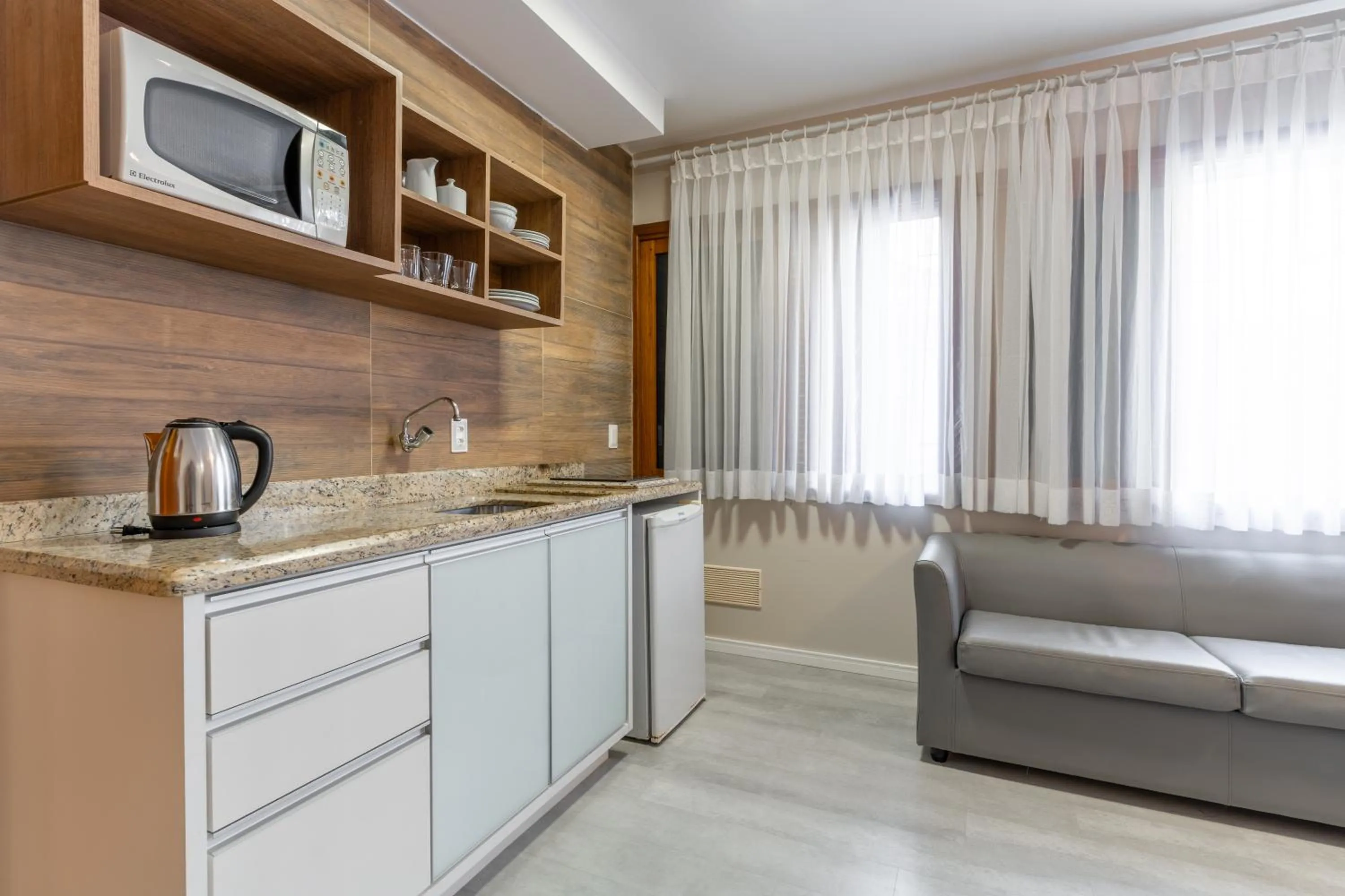 Living room in Bossa Jurerê Hotel