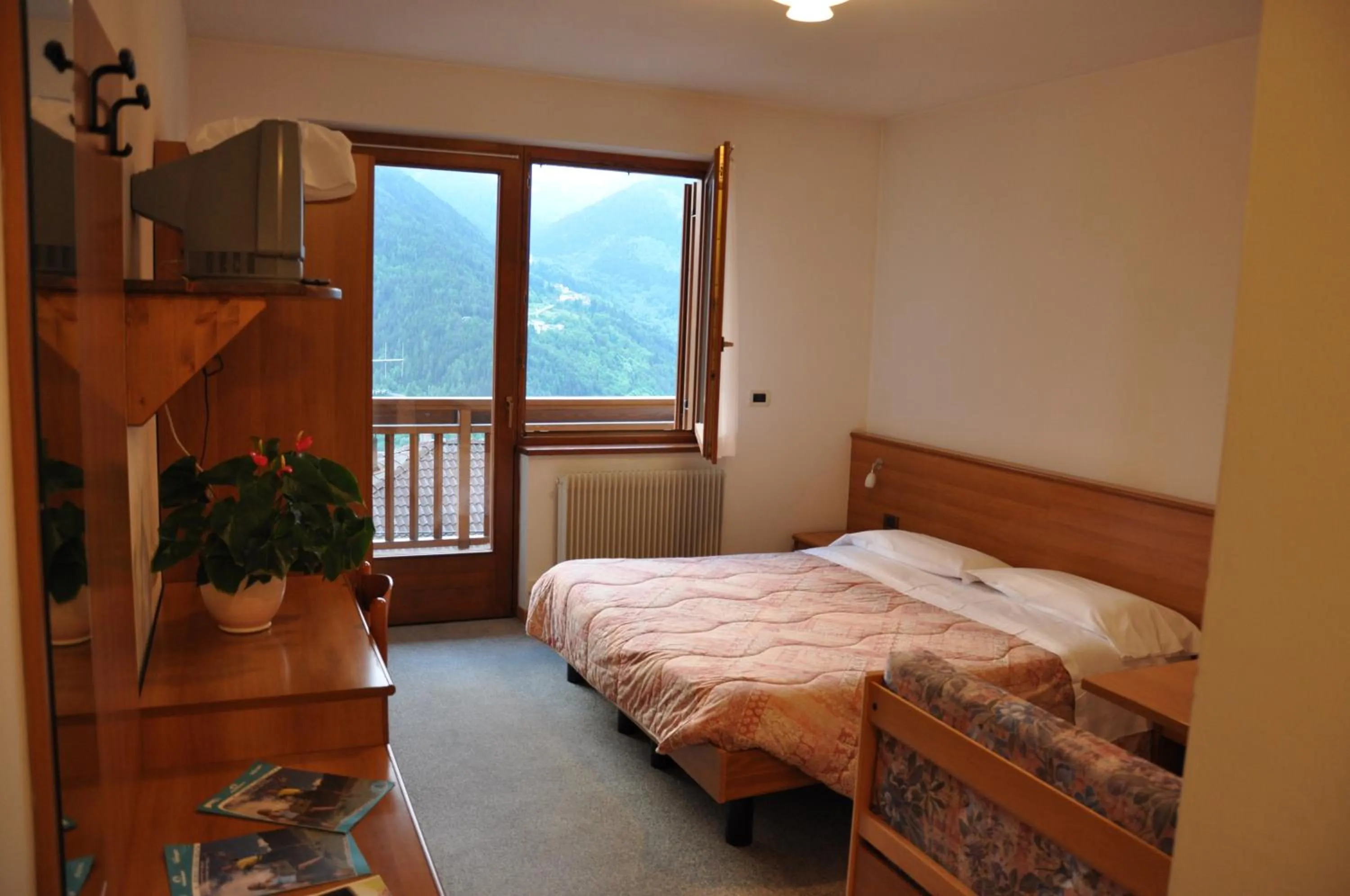 Photo of the whole room, Bed in Albergo Dolomiti
