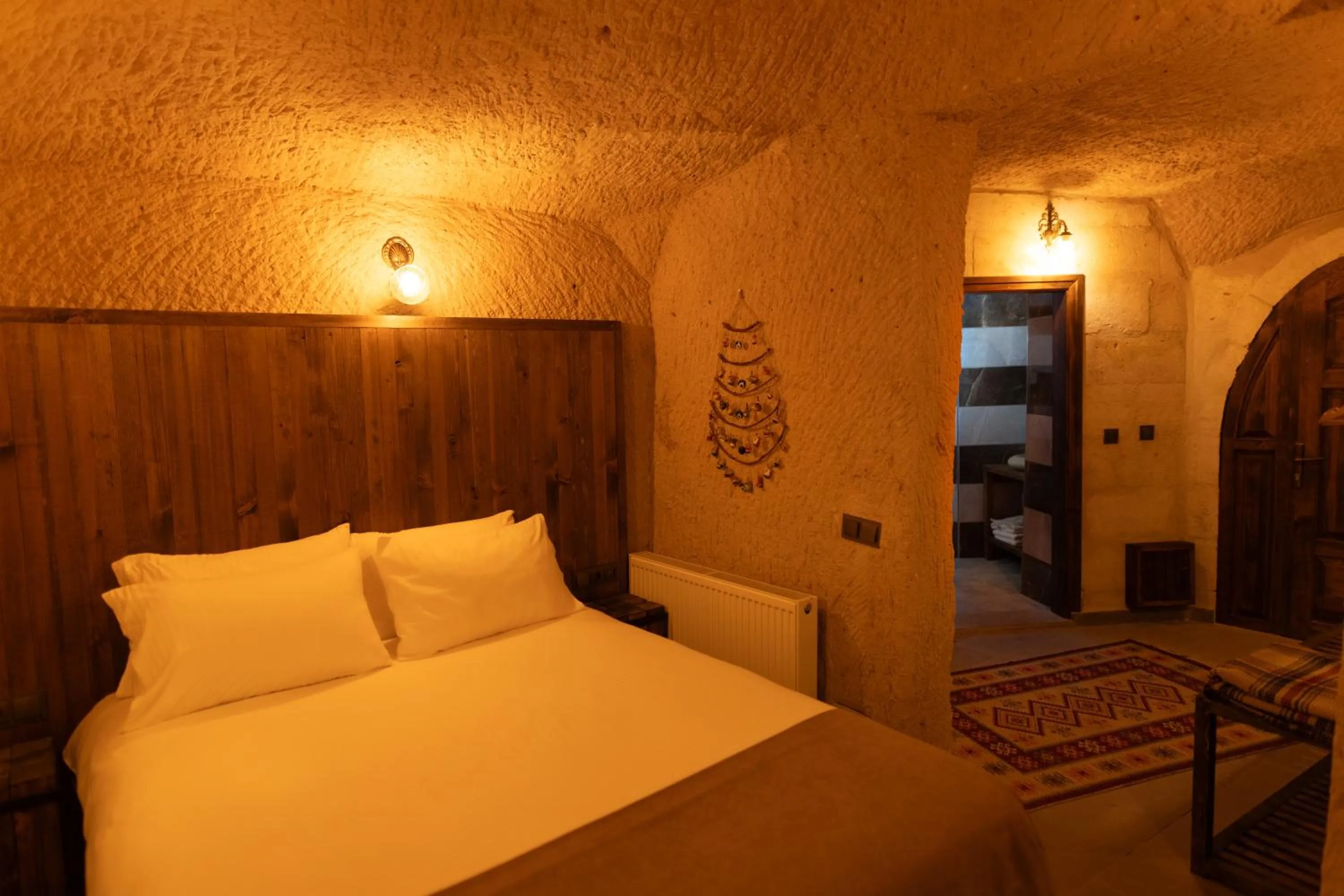 Bed in Lemon Cave Suites